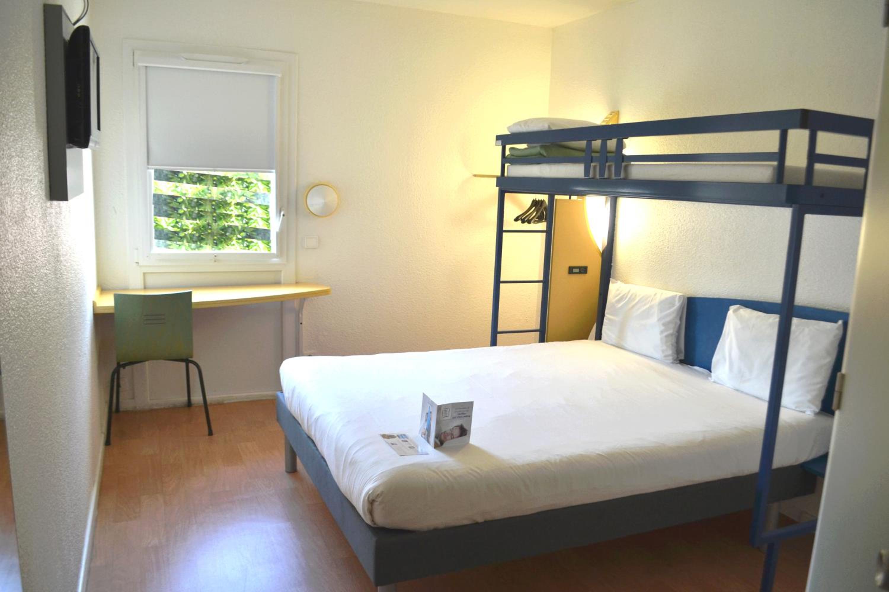 Room with a Double Bed and One Single Bed