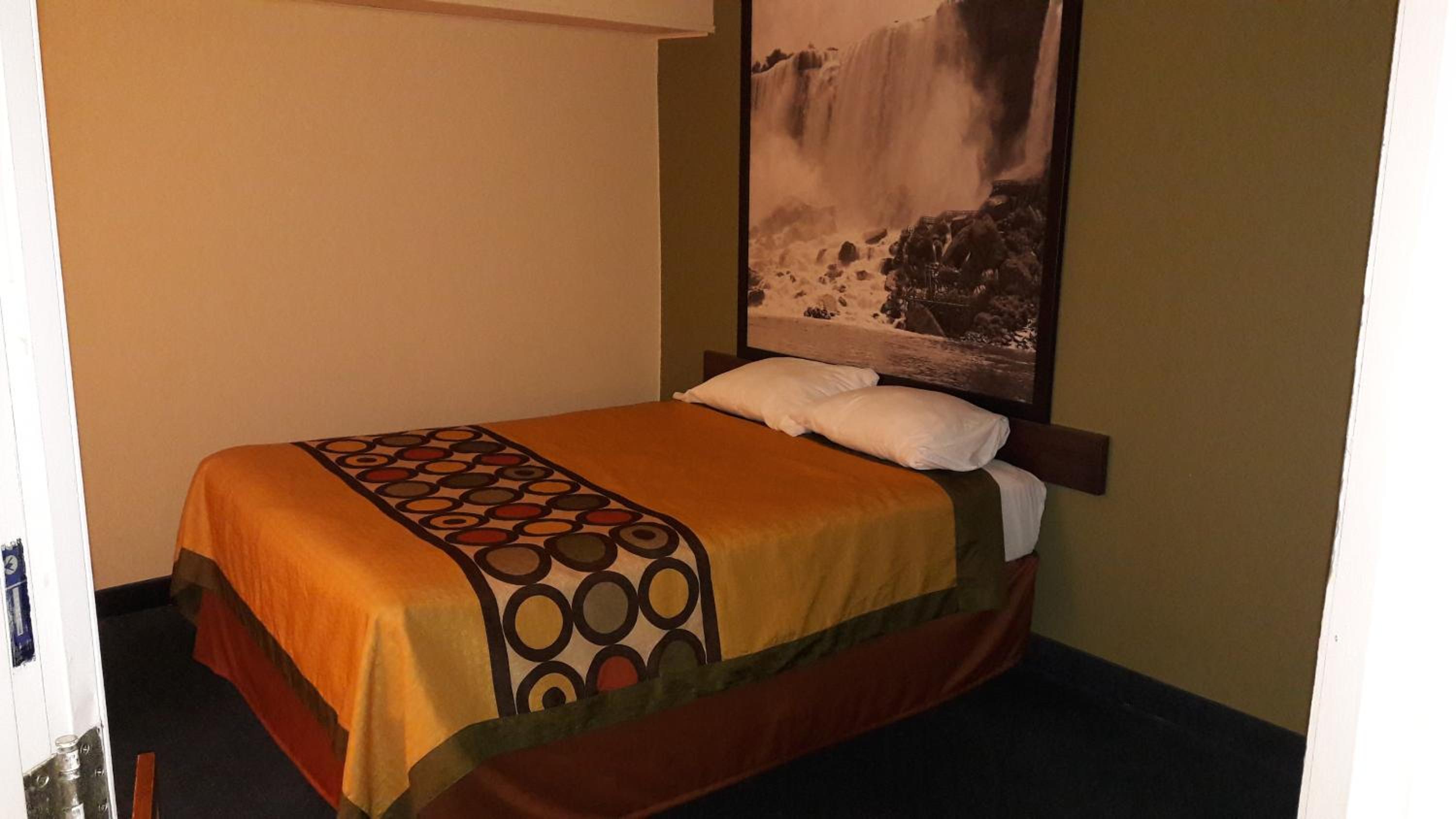 Suite with One Queen and Two Double Beds - Non-Smoking photo 2