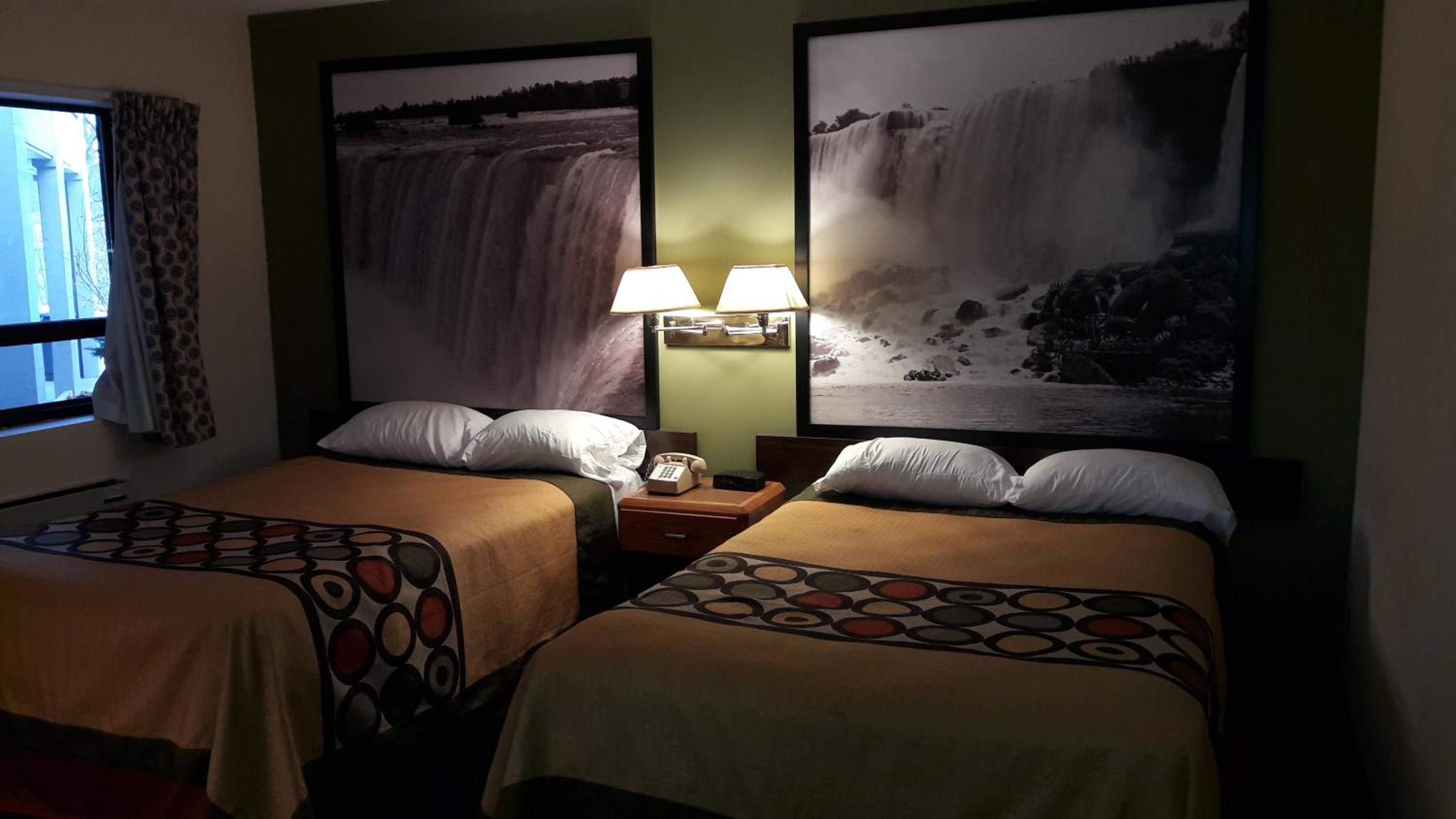 Suite with One Queen and Two Double Beds - Non-Smoking photo 3