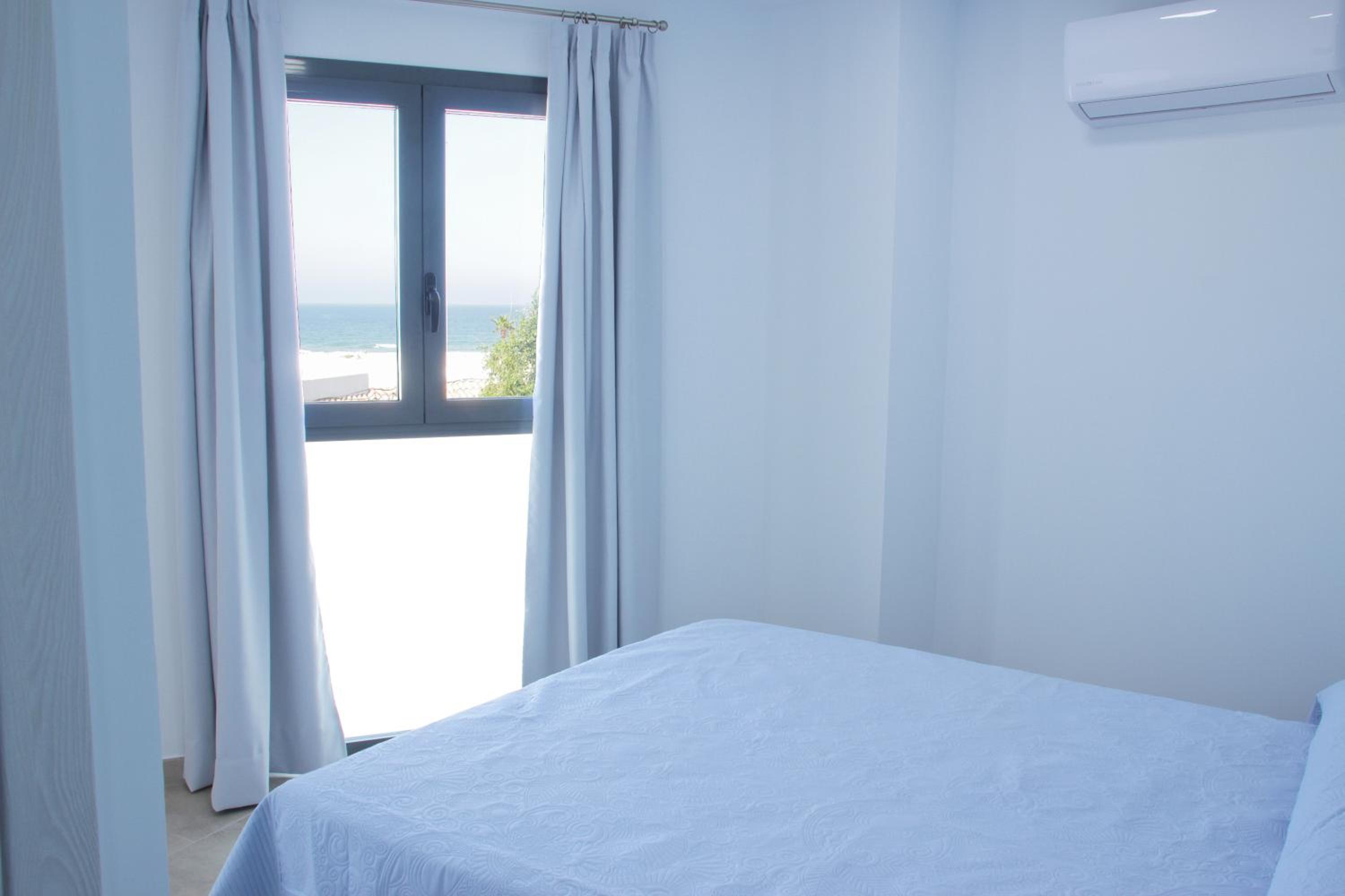 Habitación Doble con Vista al Mar desde la cama