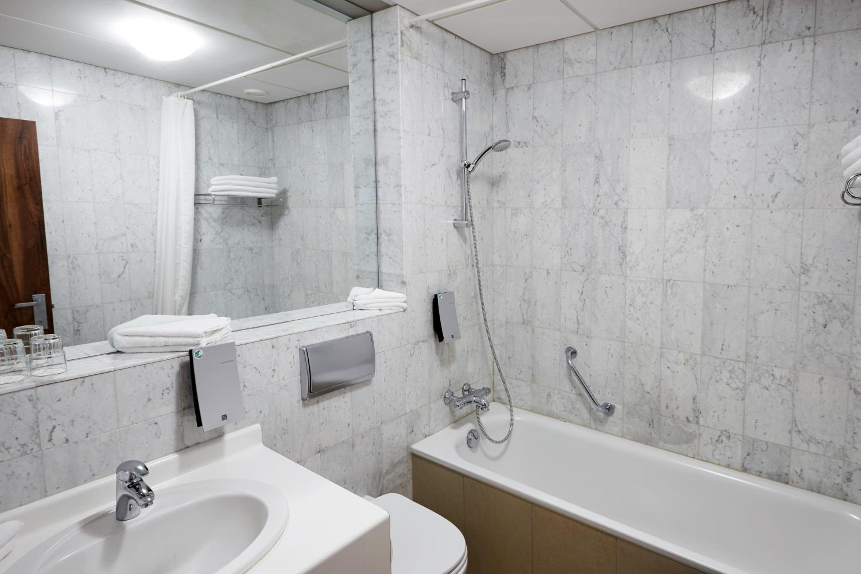 Relax in style with our luxurious marble bathroom.