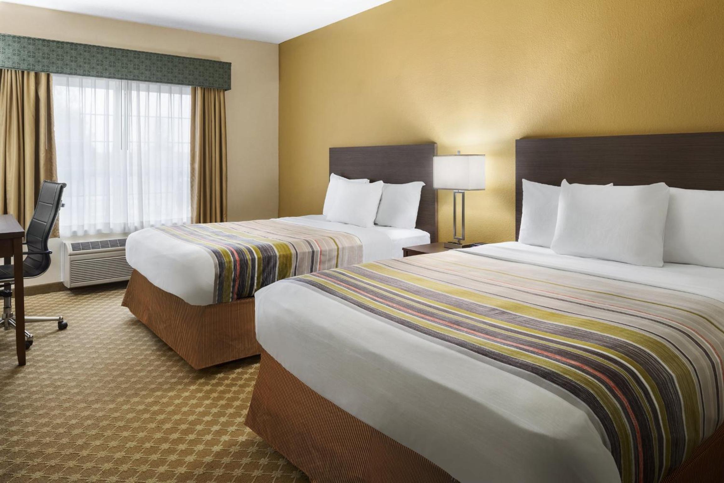 Queen Room with Two Queen Beds - Photo 1
