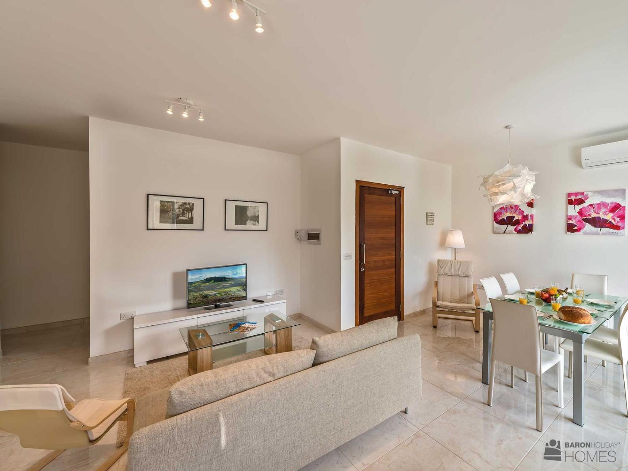 Three-Bedroom Apartment with Balcony and Pool View
