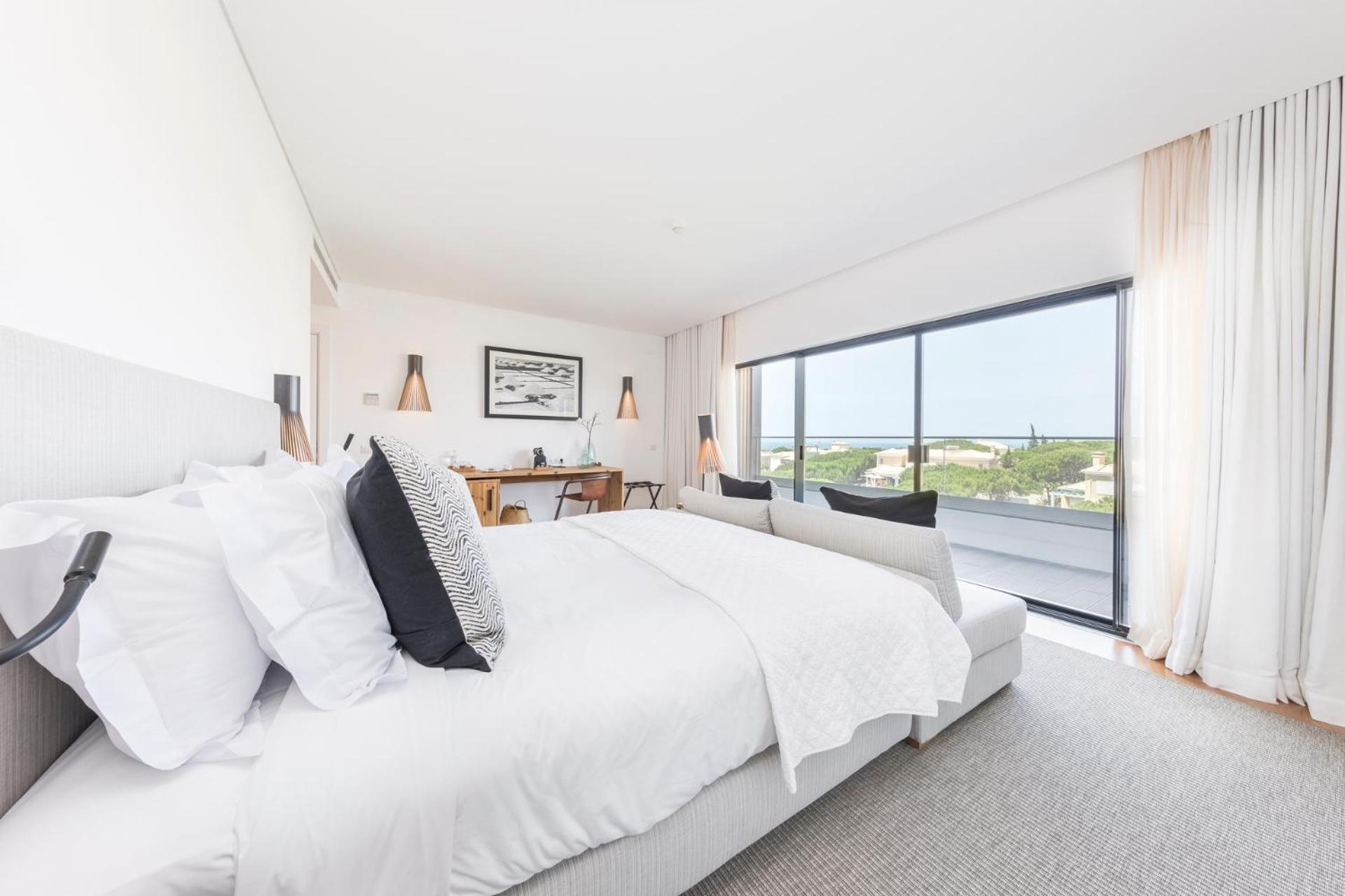 hotel room with a view of the ocean and beach