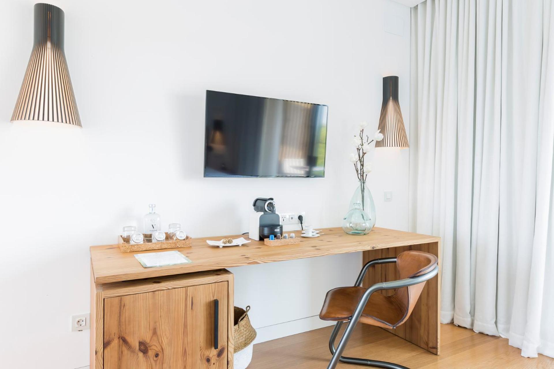 desk with a flat screen tv on top of it