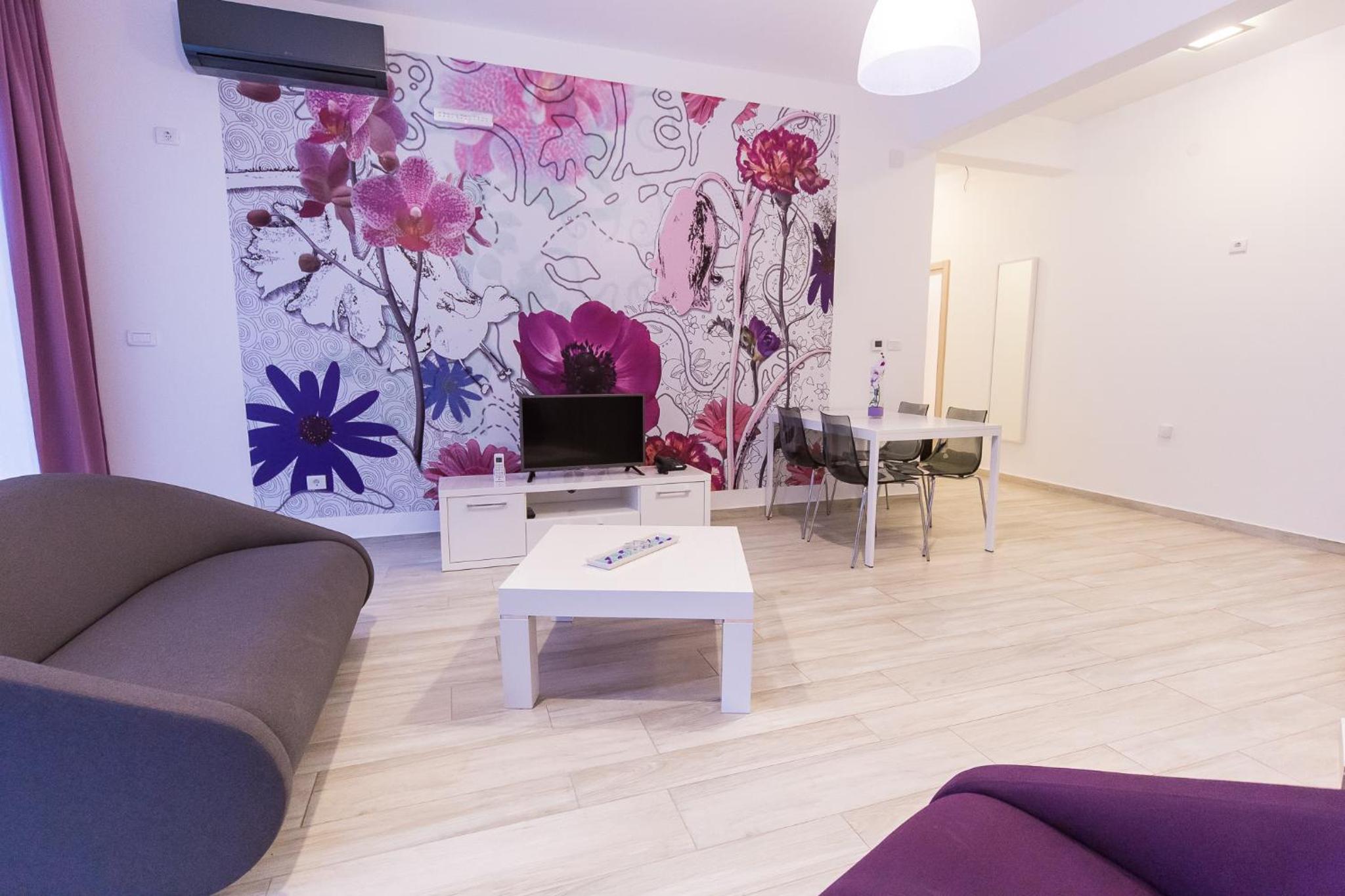 One-Bedroom Apartment with Balcony and Garden View
