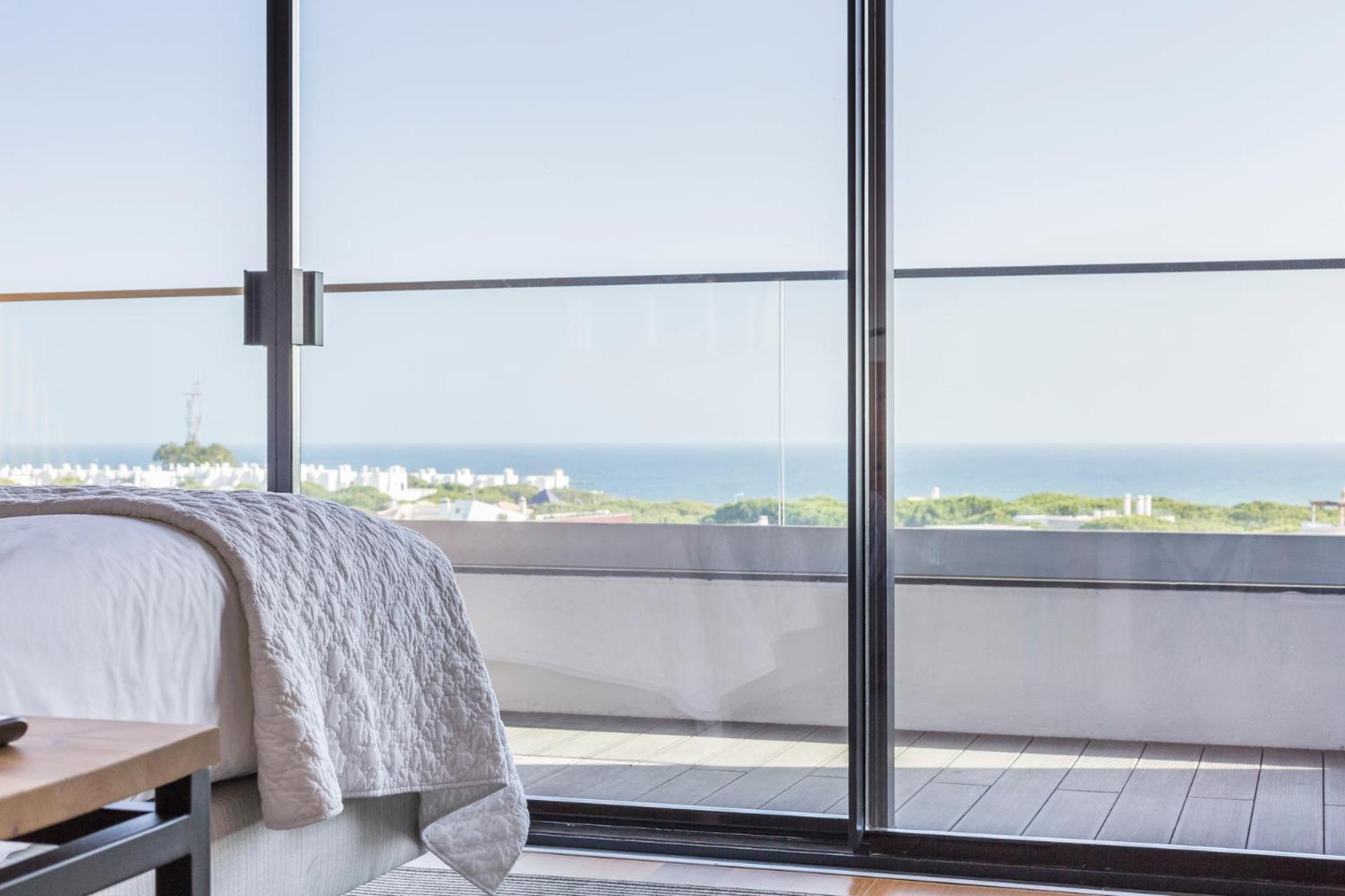 view of the ocean from one of the bedroom windows