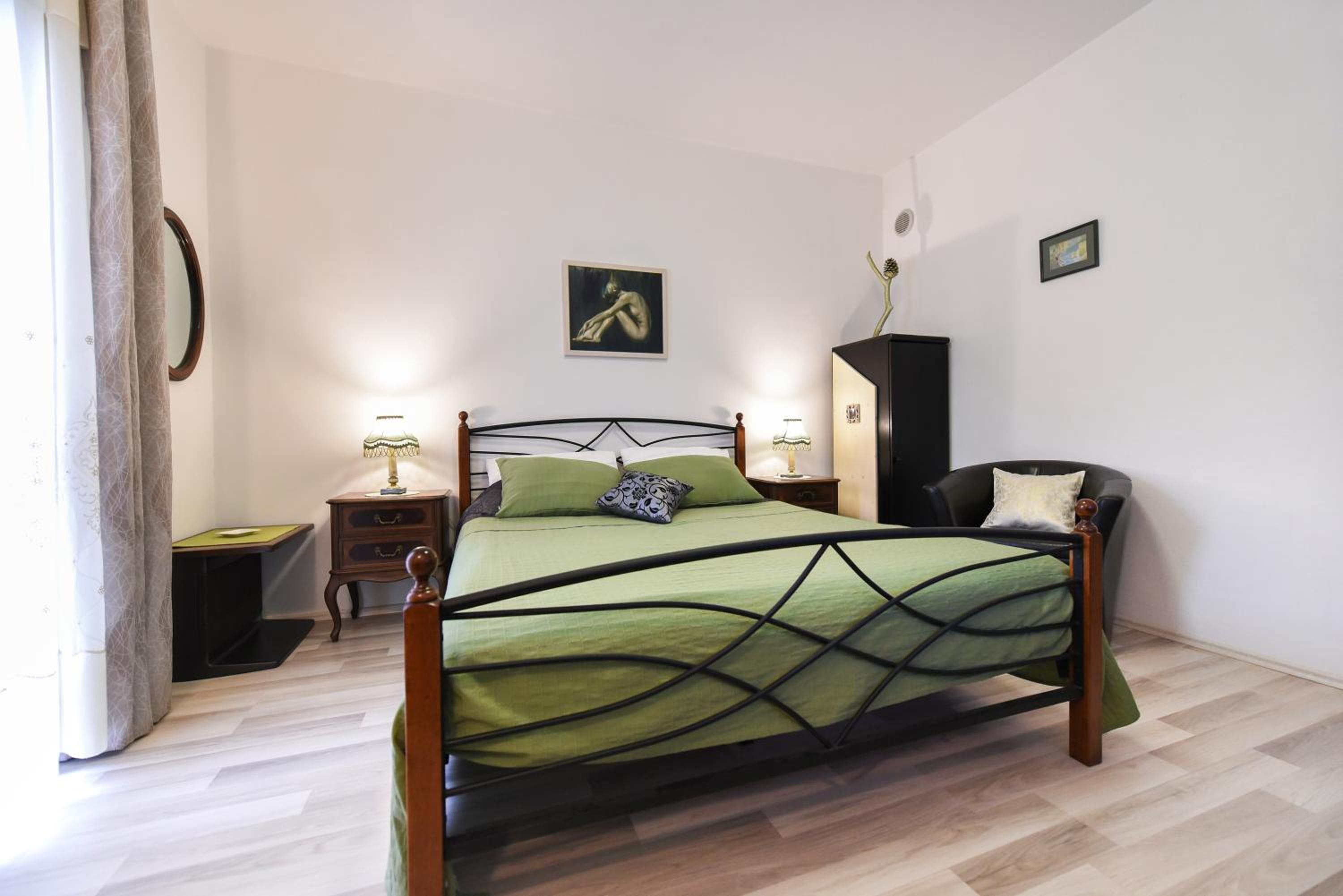 One-Bedroom Apartment with Balcony and Garden View