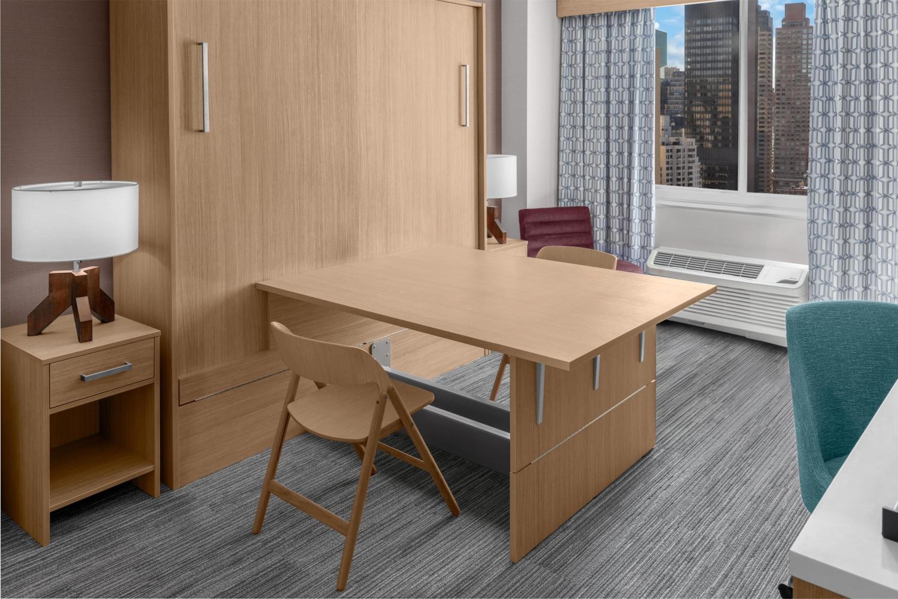 Studio with King Wall Bed and Conference Table
