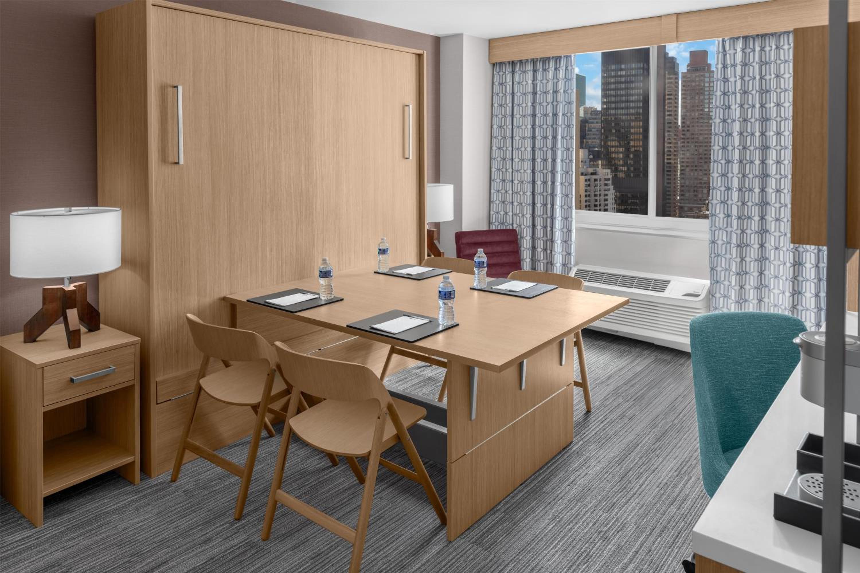 Studio with King Wall Bed and Conference Table thumbnail 6