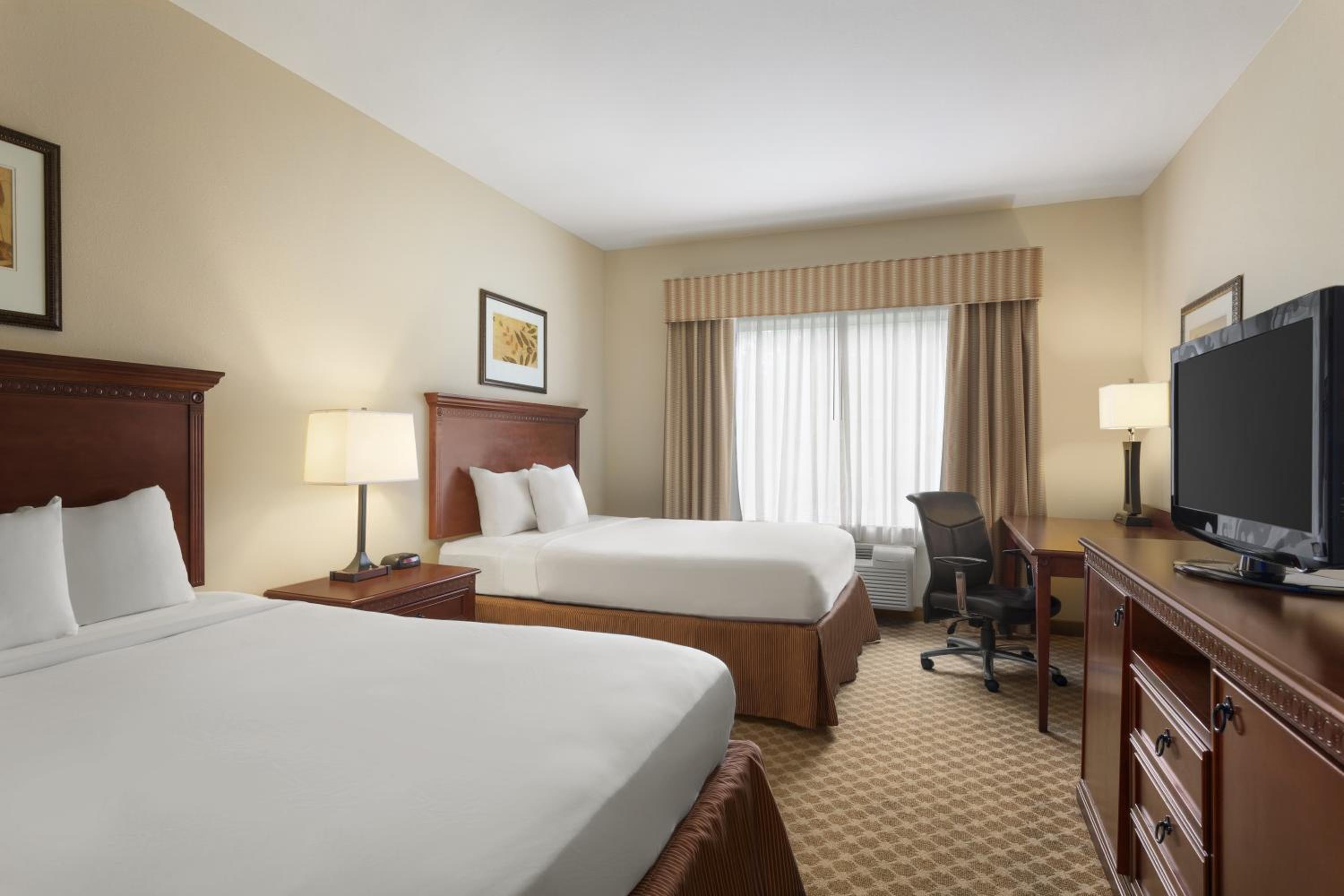 Queen Room with Two Queen Beds - Pet Friendly/Non-Smoking - Photo 1