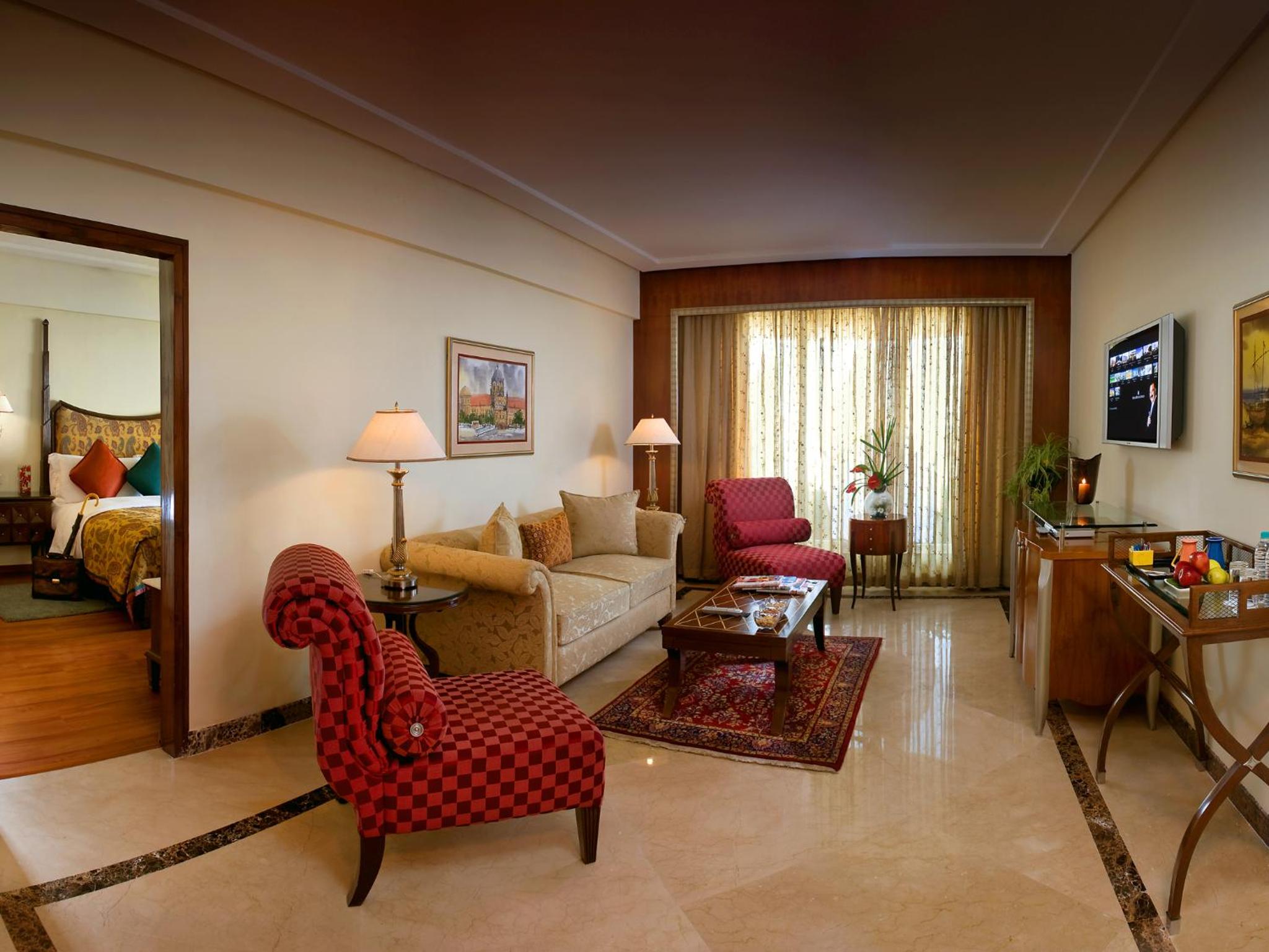 Lalit Executive Suite, King Bed with Complimentary One way Airport Transfers , 15% off on session on Spa and Enjoy Happy Hours with 1+1 offer on Beverages - Photo 1