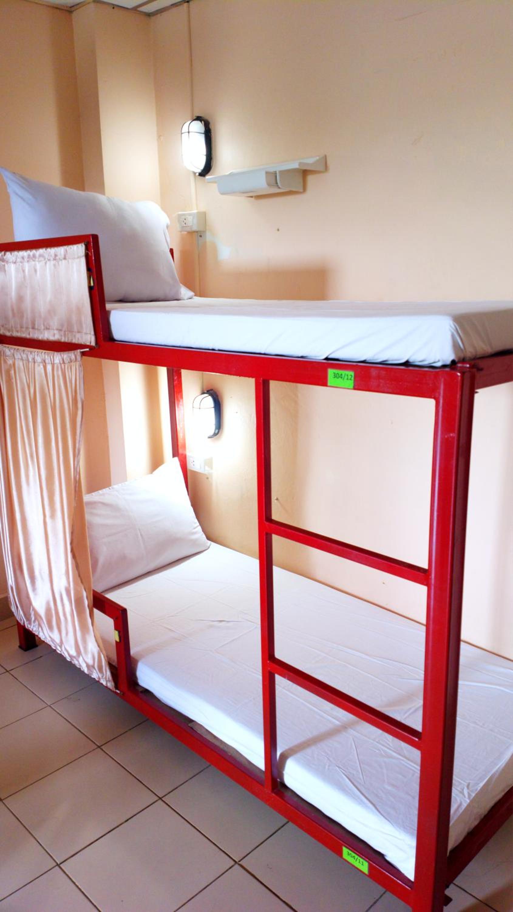 Bed in Dormitory Room with Air Conditioning