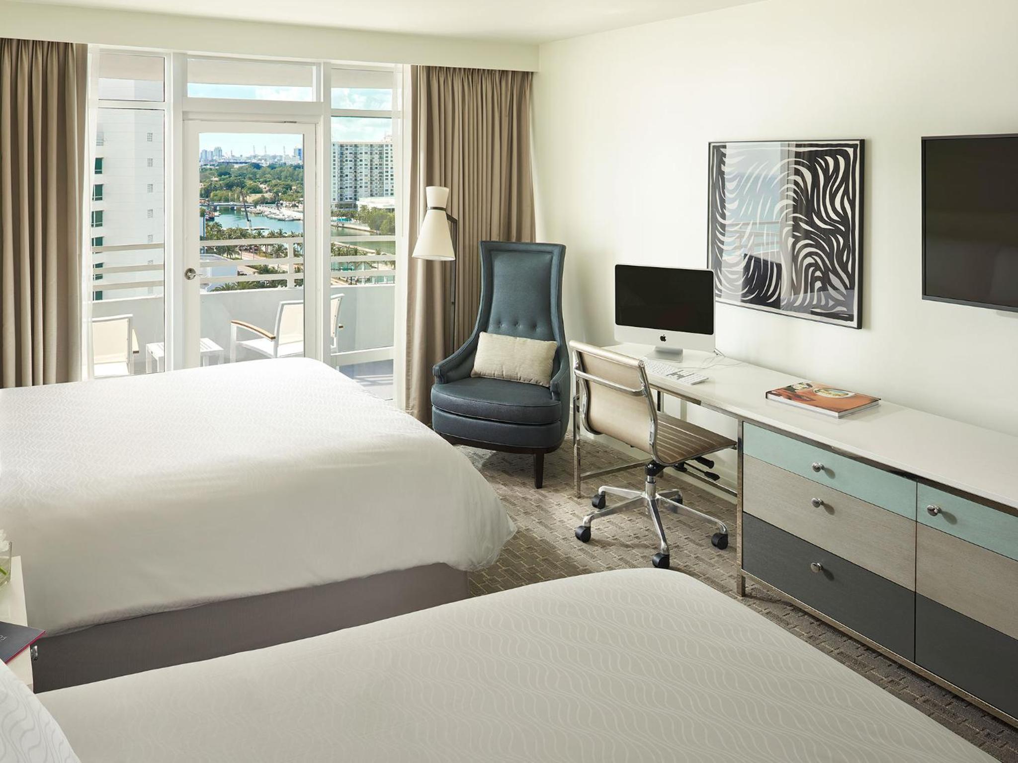 Deluxe Queen Room with Two Queen Beds and Balcony photo 1