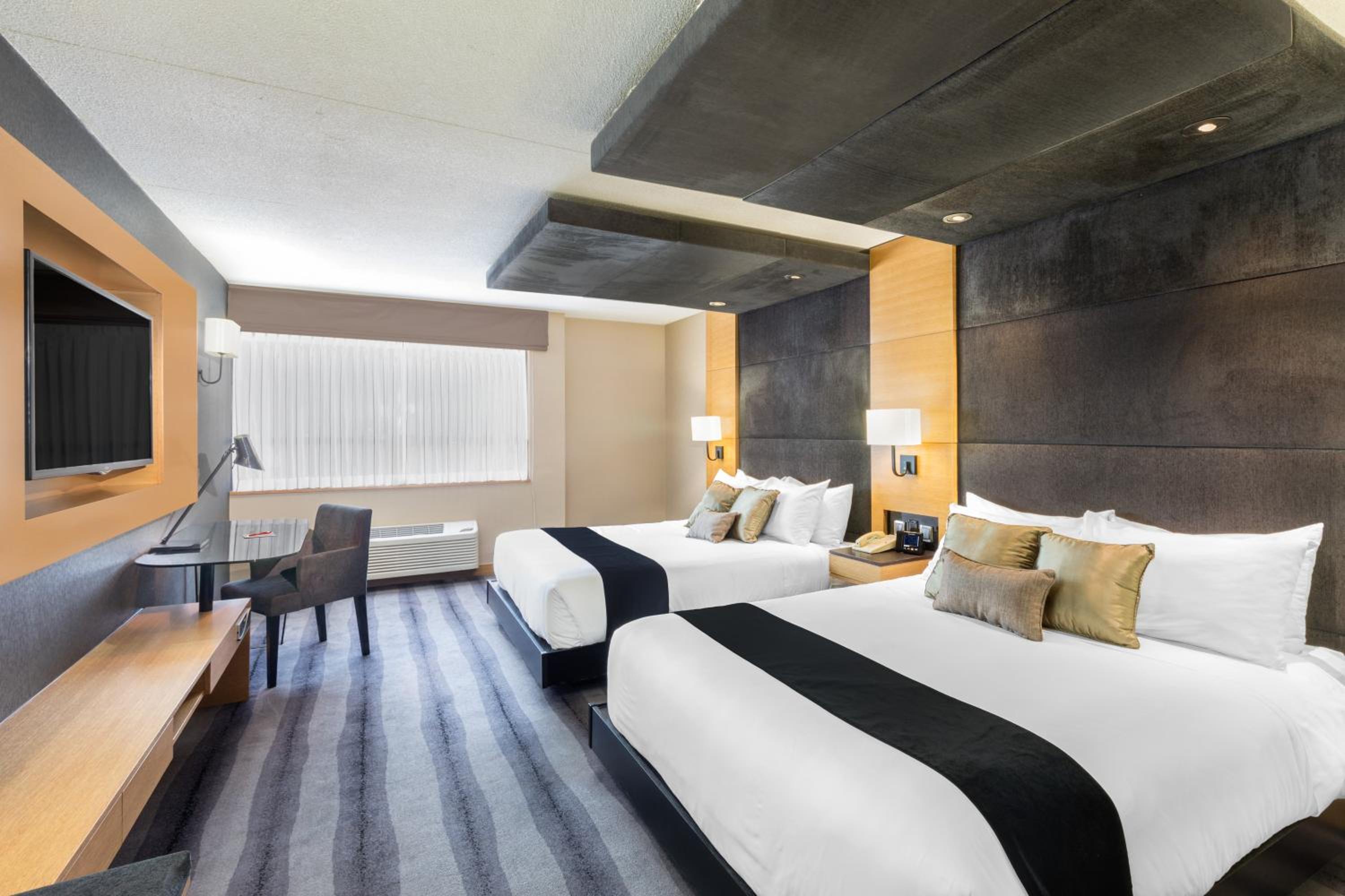 Premier Queen Room with Two Queen Beds - Photo 1