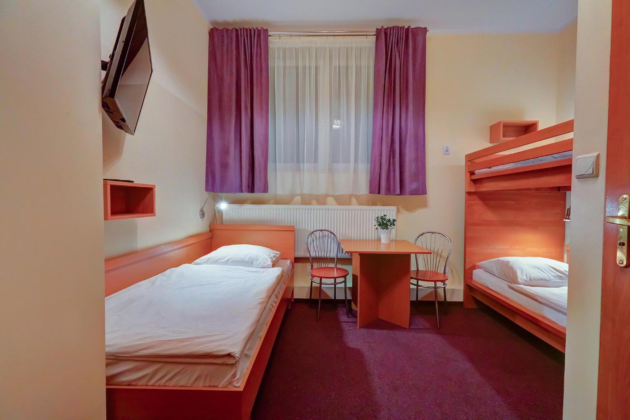 Standard Triple Room with Private Bathroom - Photo 1