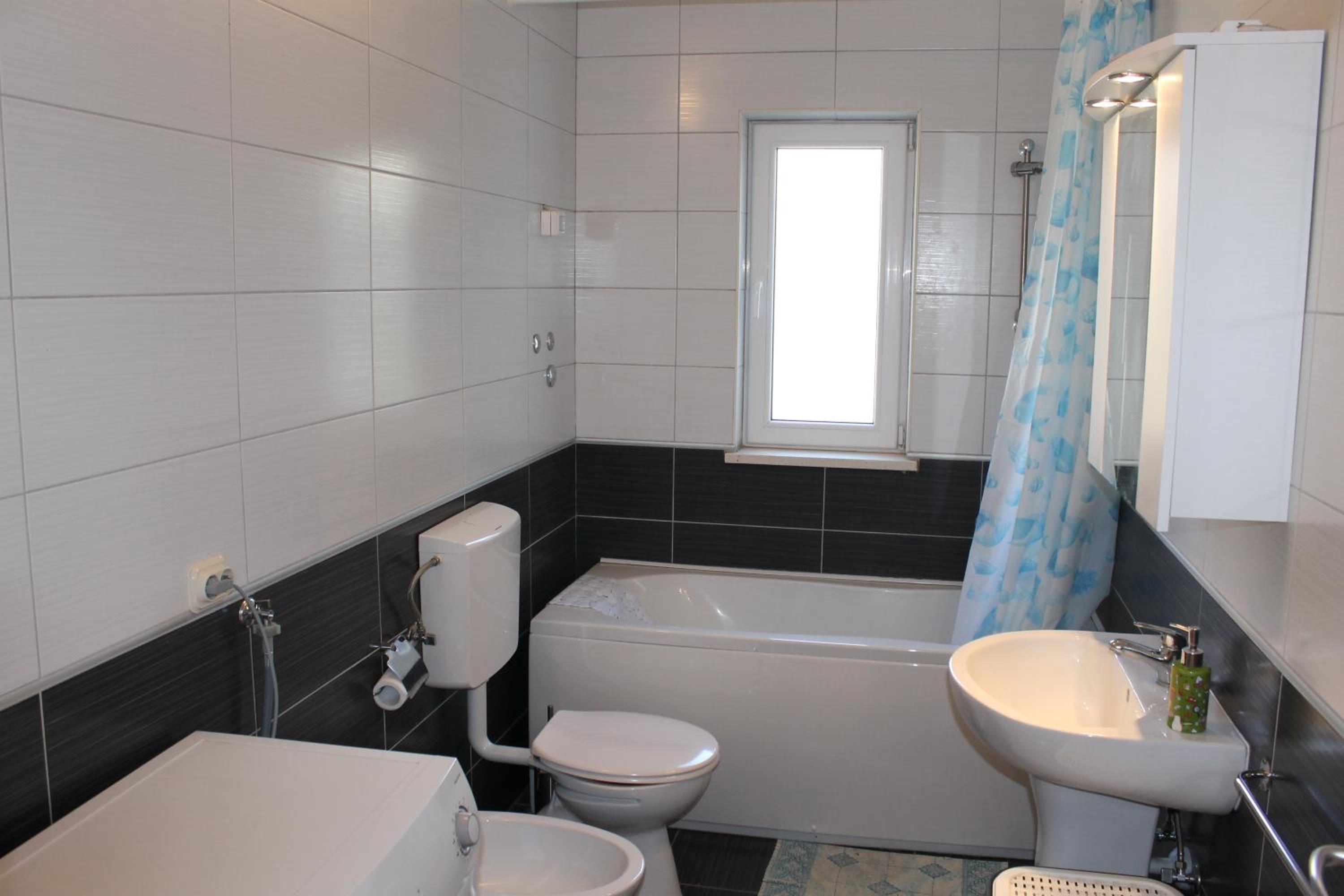 Three-Bedroom Apartment - Photo 2