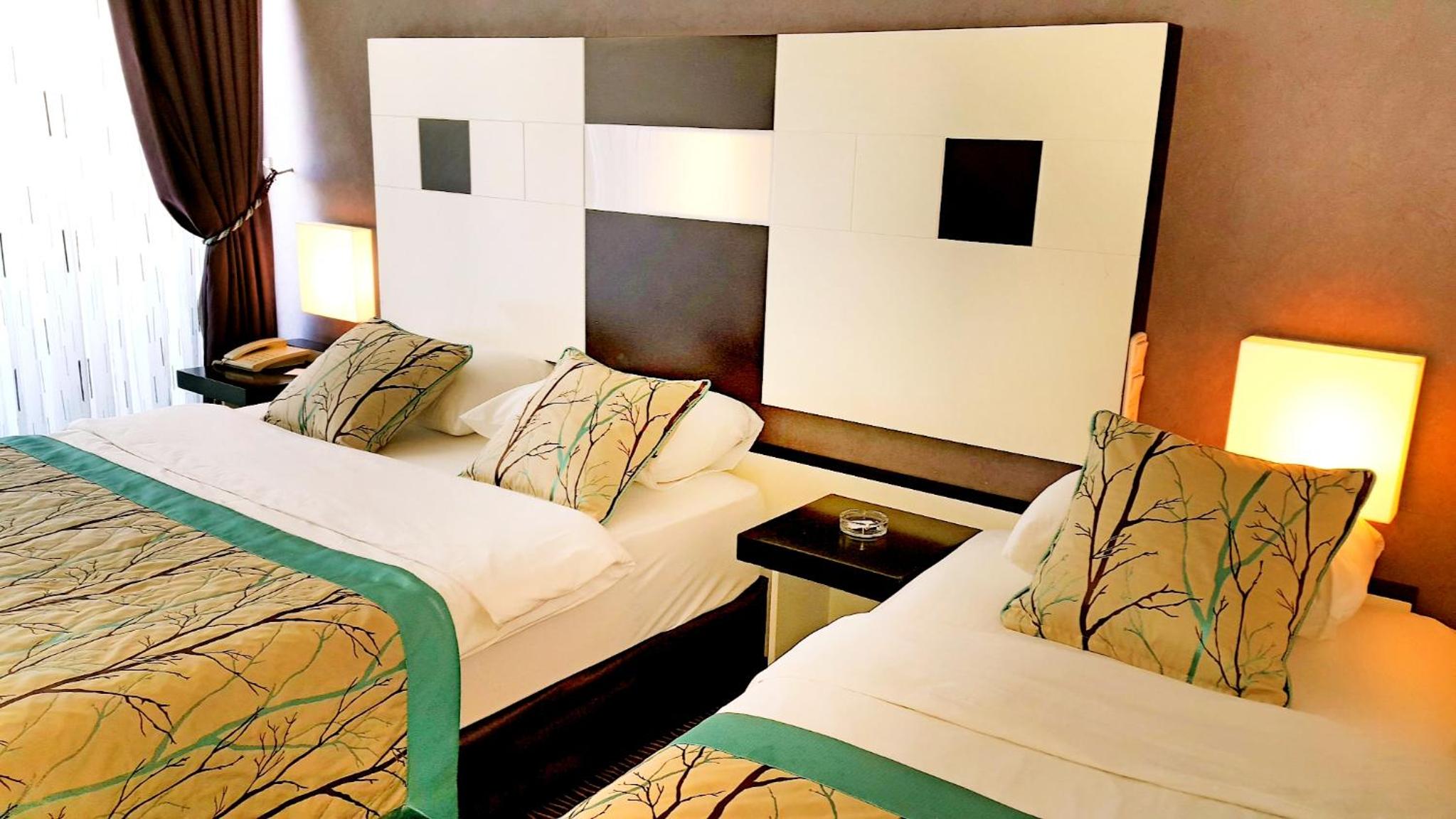 Standard Triple Room with Side Sea View