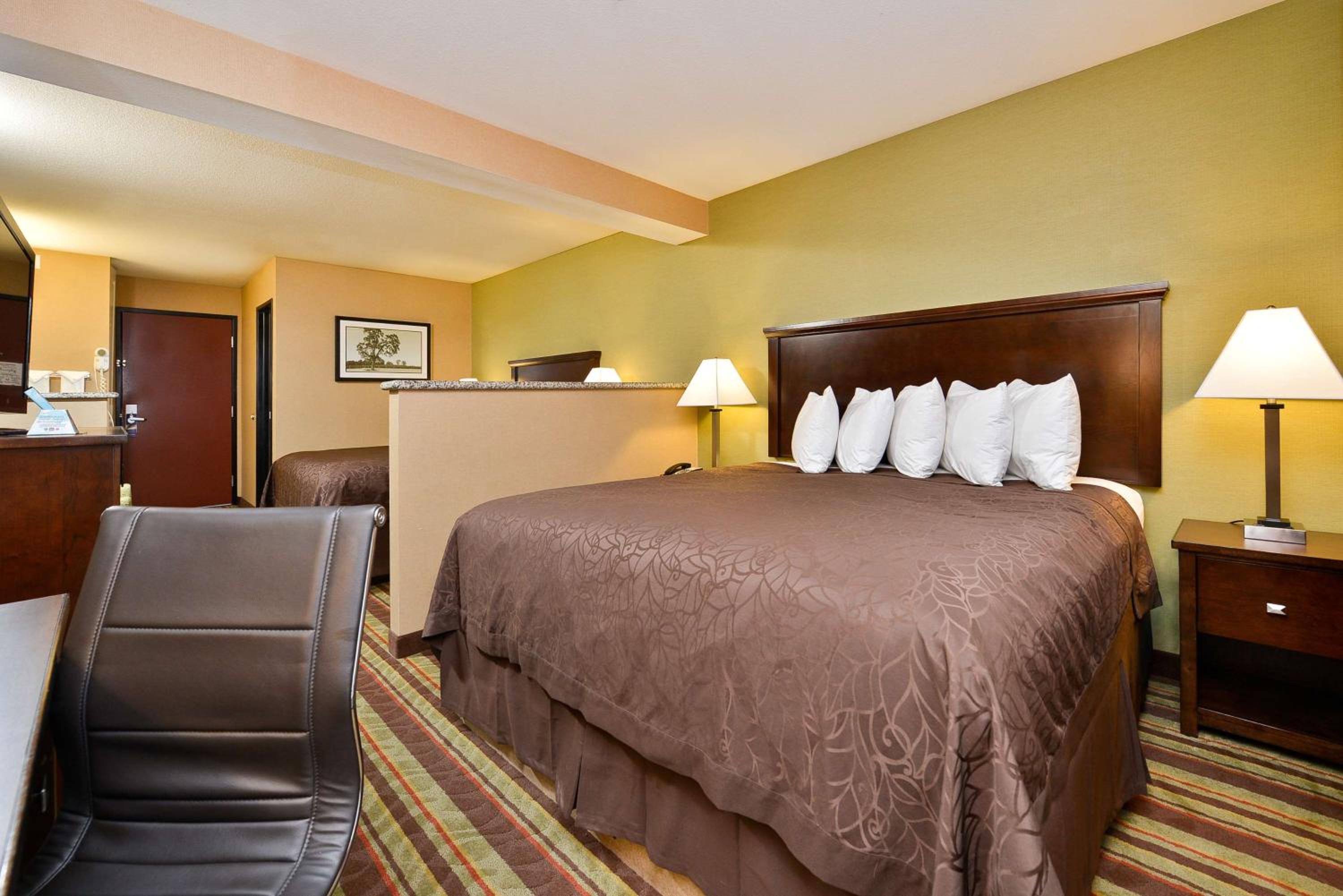 Suite with One King and One Queen Bed - Non-Smoking - Photo 1