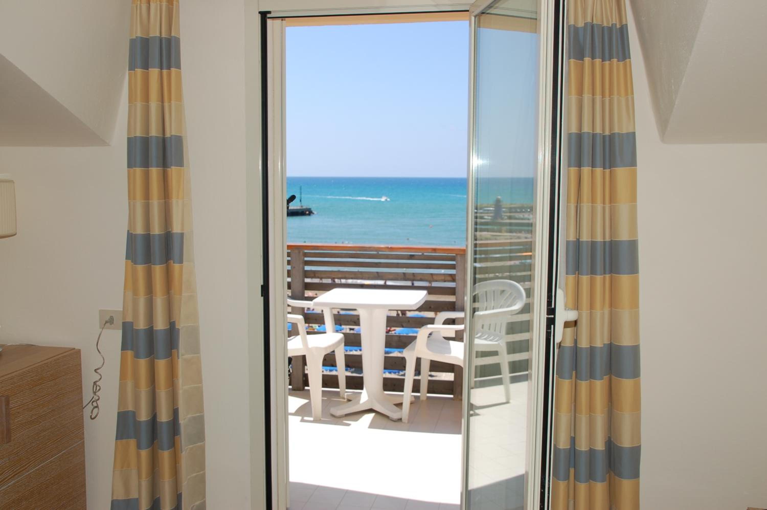 Family Room (2 Adults + 2 Children) with Balcony and Sea View photo 2