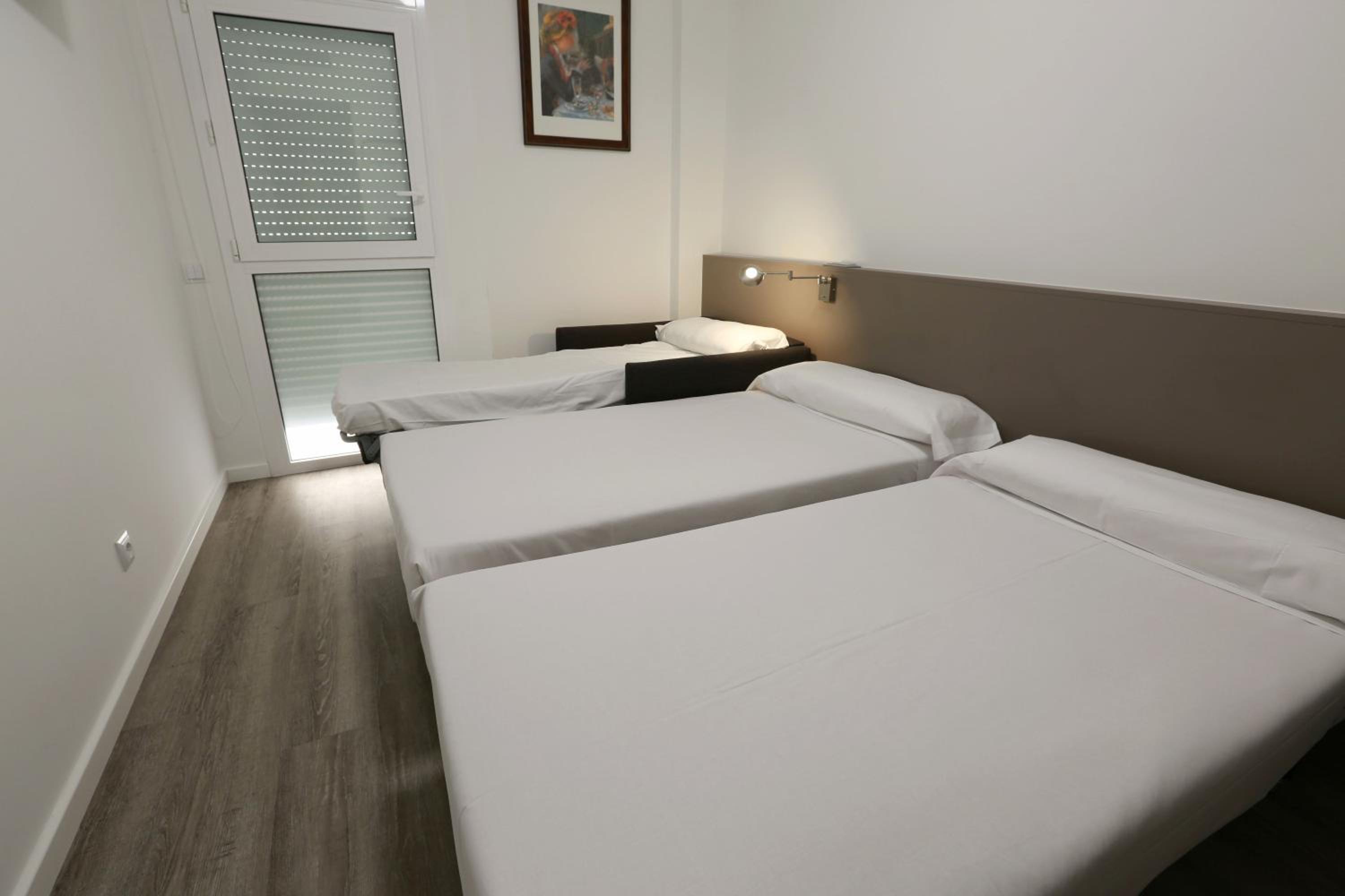 Habitación Doble con Sofá Cama