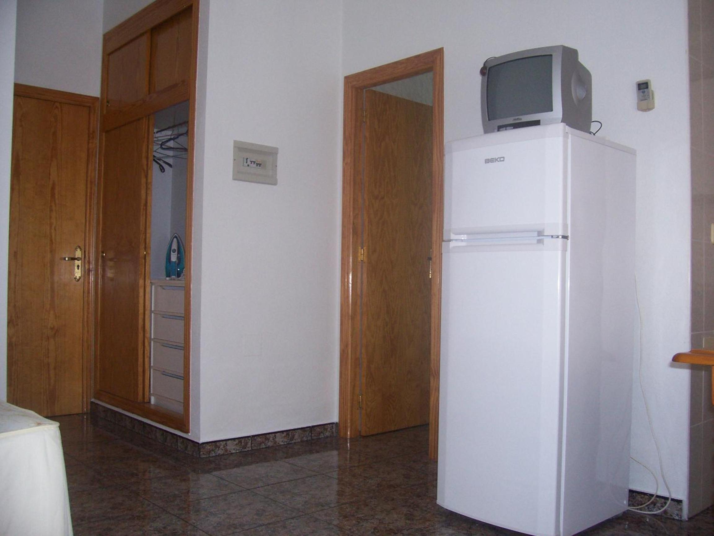 Estudio Queen con Sofá Cama