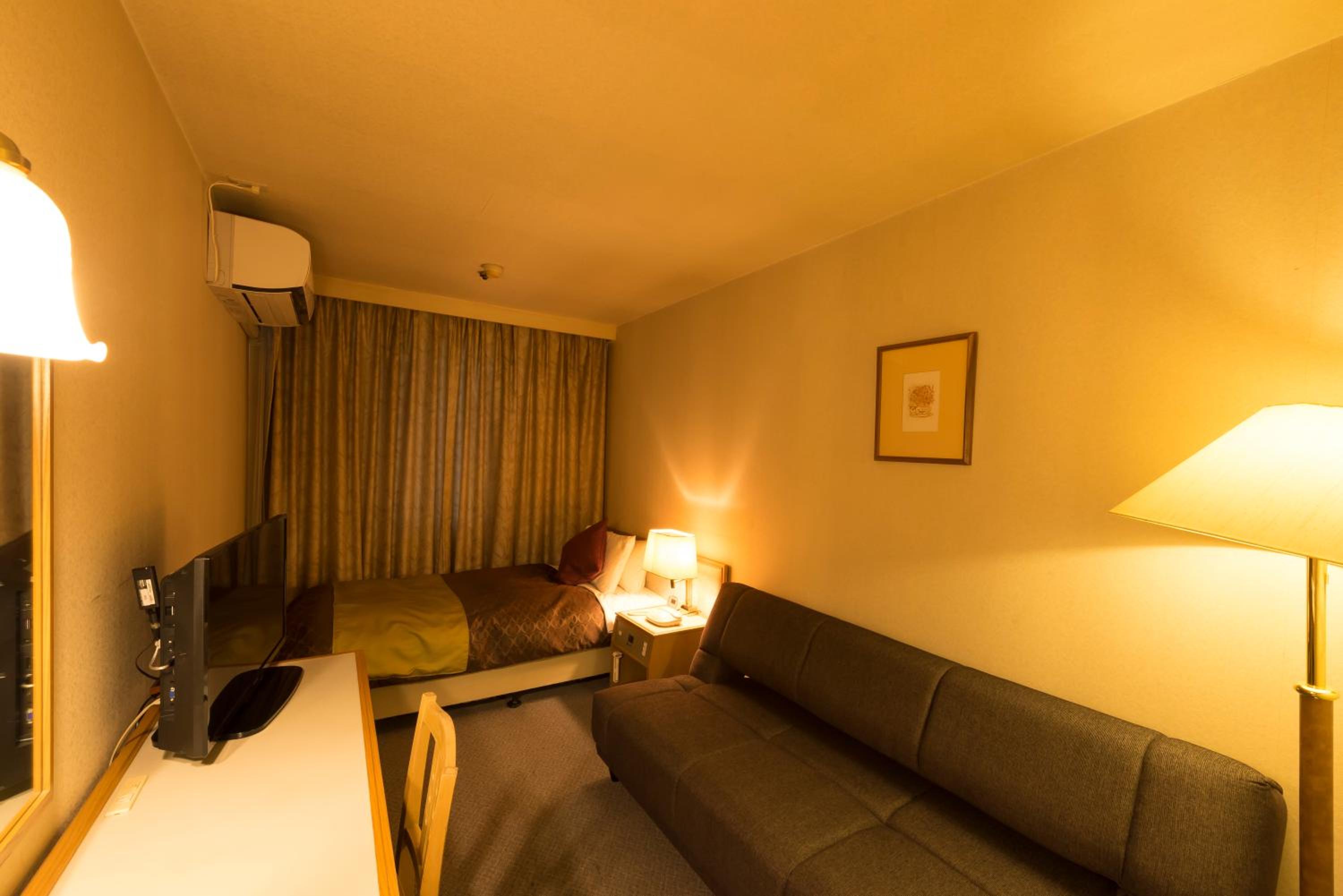 Single Room with Sofa - Smoking photo 1