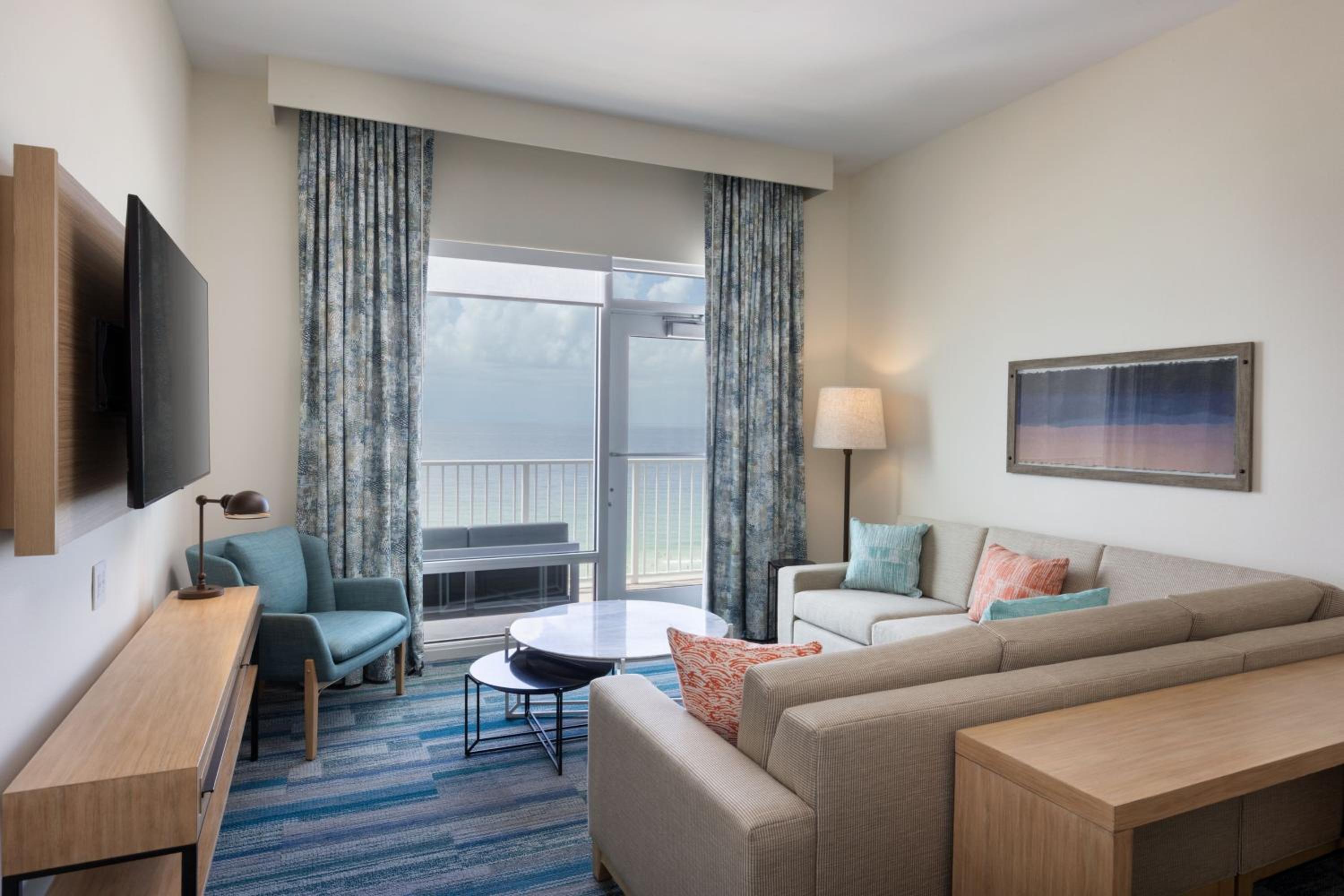 One-Bedroom Suite with One King Bed, One Set of Bunk Beds, Beach View, Balcony and Sofa Bed