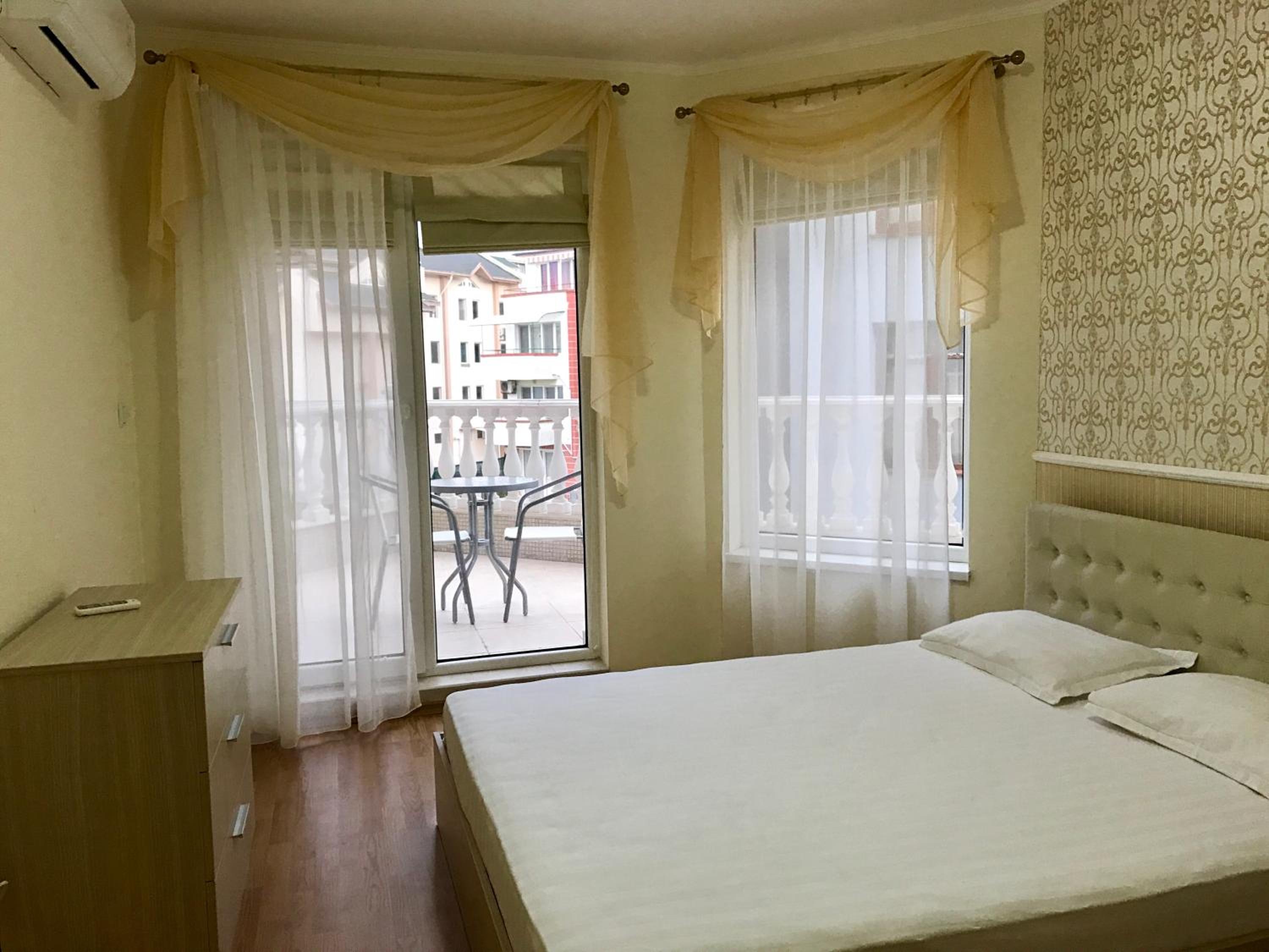 One-Bedroom Apartment with Balcony and Town View photo 1