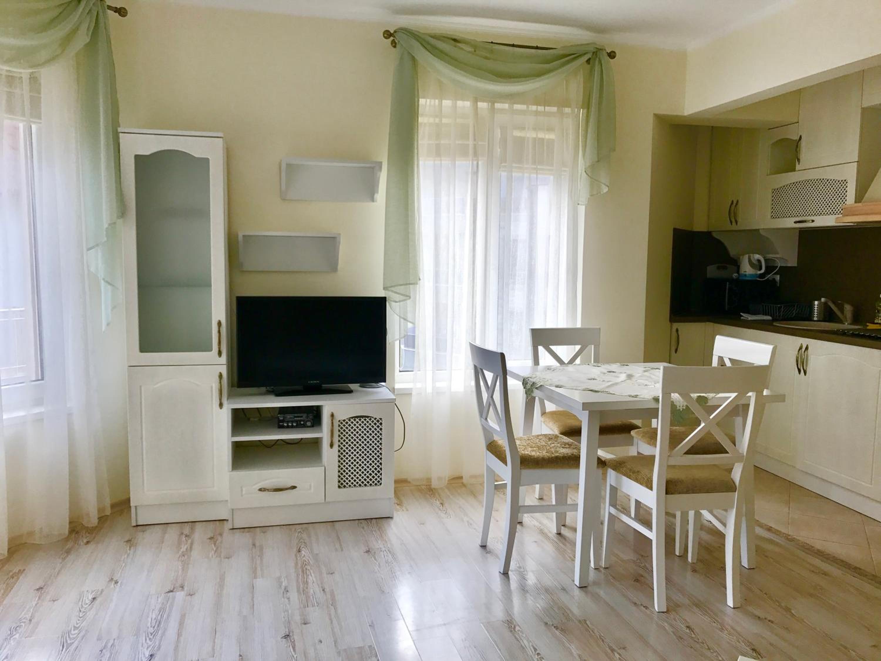 One-Bedroom Apartment with Balcony and Town View photo 2