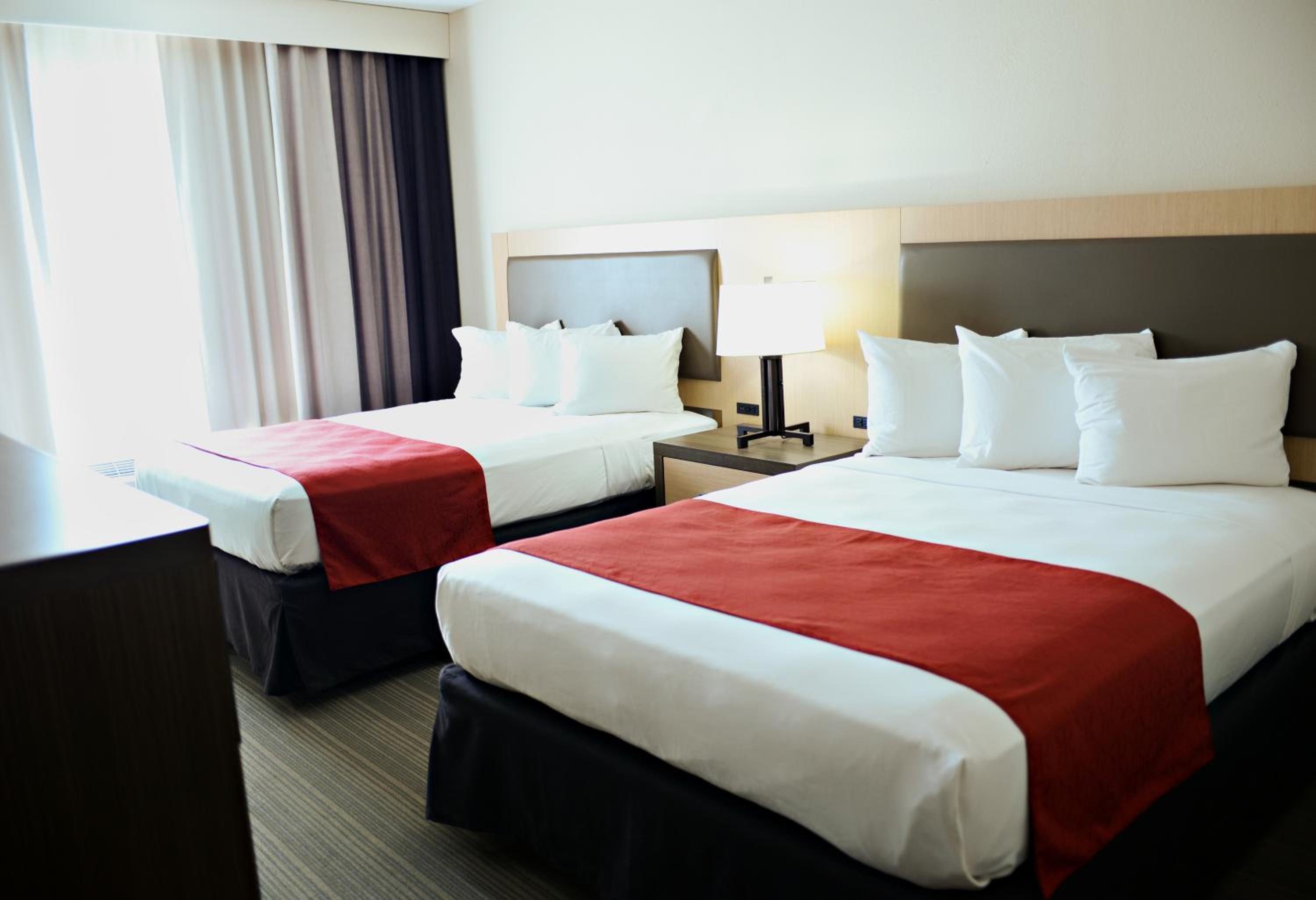 Queen Room with Two Queen Beds - Non-Smoking - Photo 1
