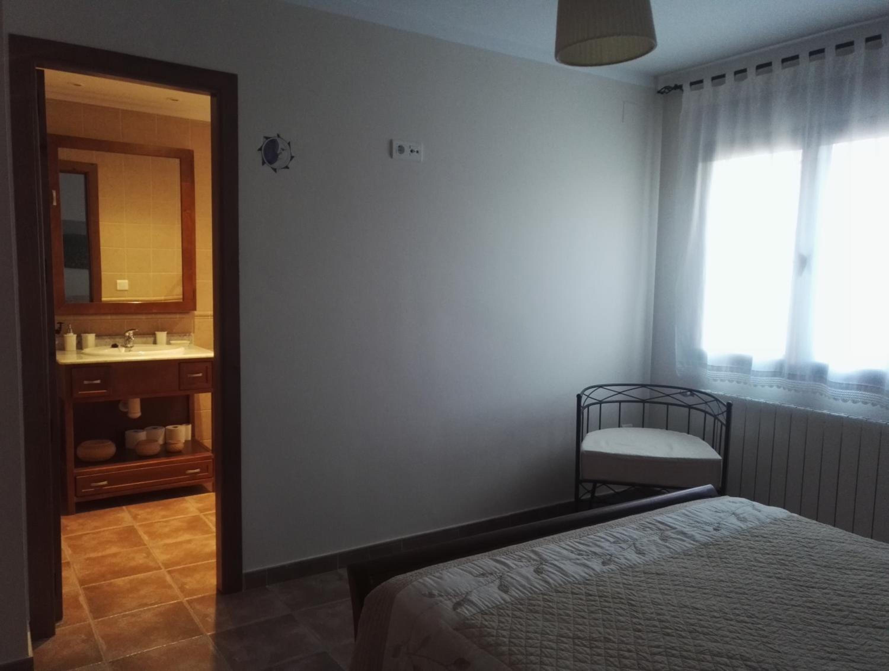 Three-Bedroom House - Photo 34