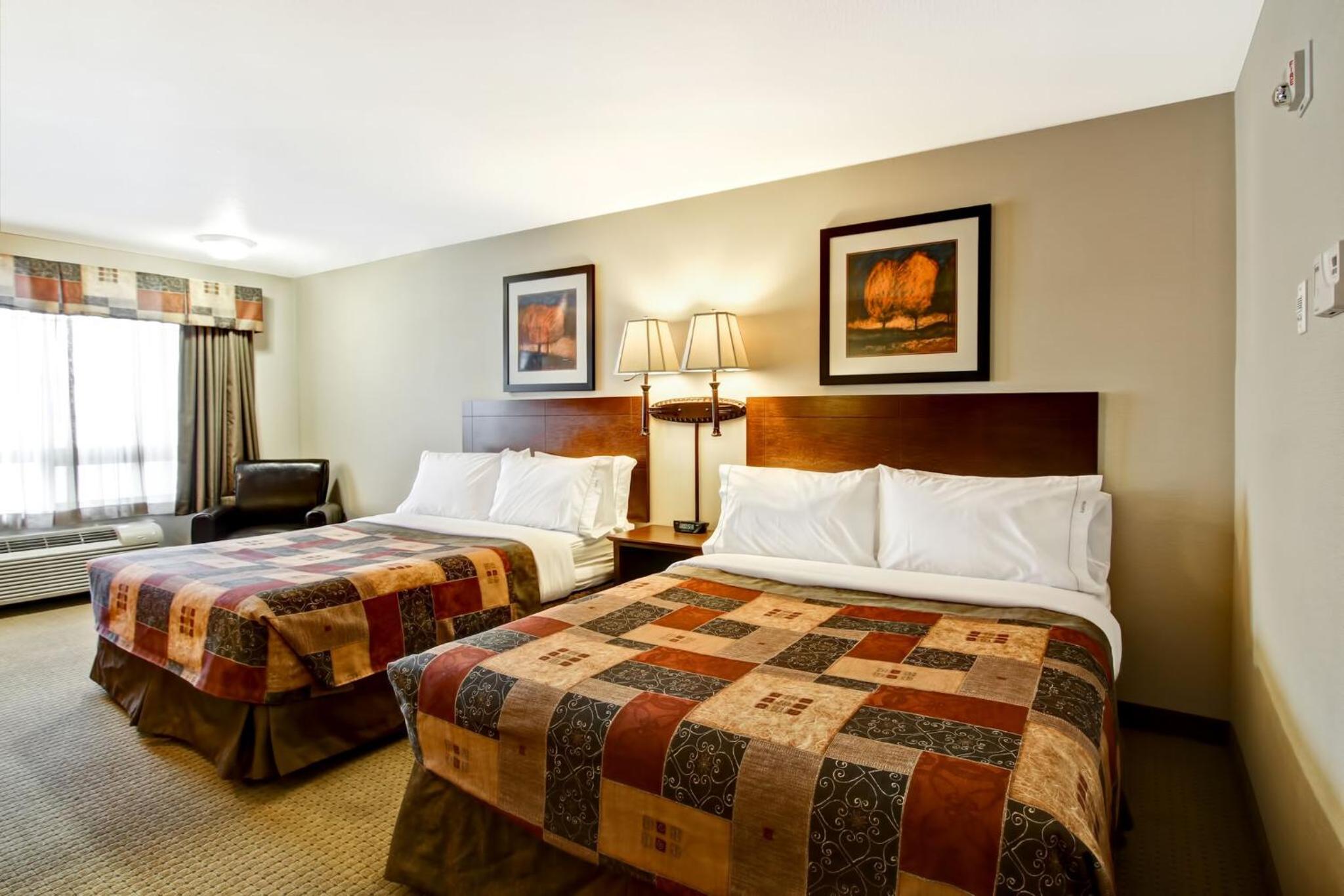 Queen Room with Two Queen Beds and Sofa Bed photo 2