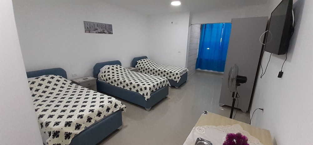 Basic Quadruple Room (4 Single Beds) photo 2