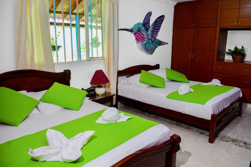 Room with 1 double bed and 3 single beds