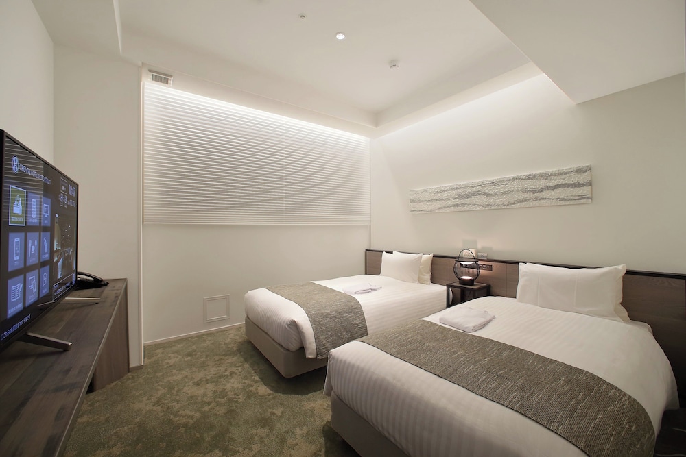Universal Twin Room - Photo 1