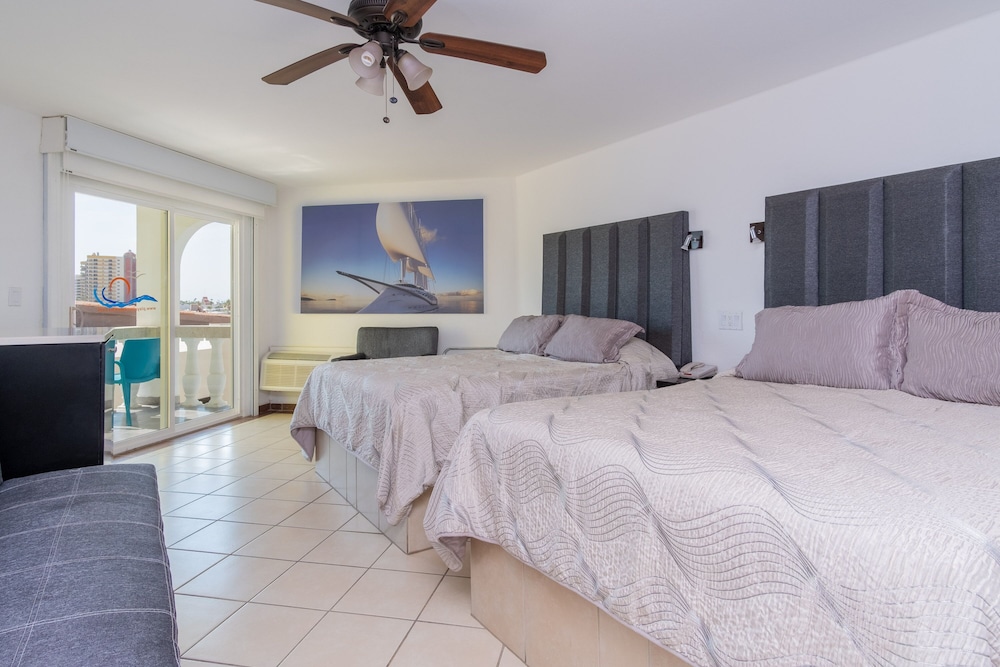 Deluxe Room, Multiple Beds, Balcony, Partial Ocean View photo 1