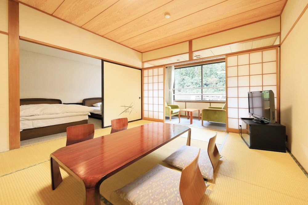 Japanese/Western-style: 10Tatami-mats + Twin Room + Separate Sitting Area (Non-smoking, with shower)