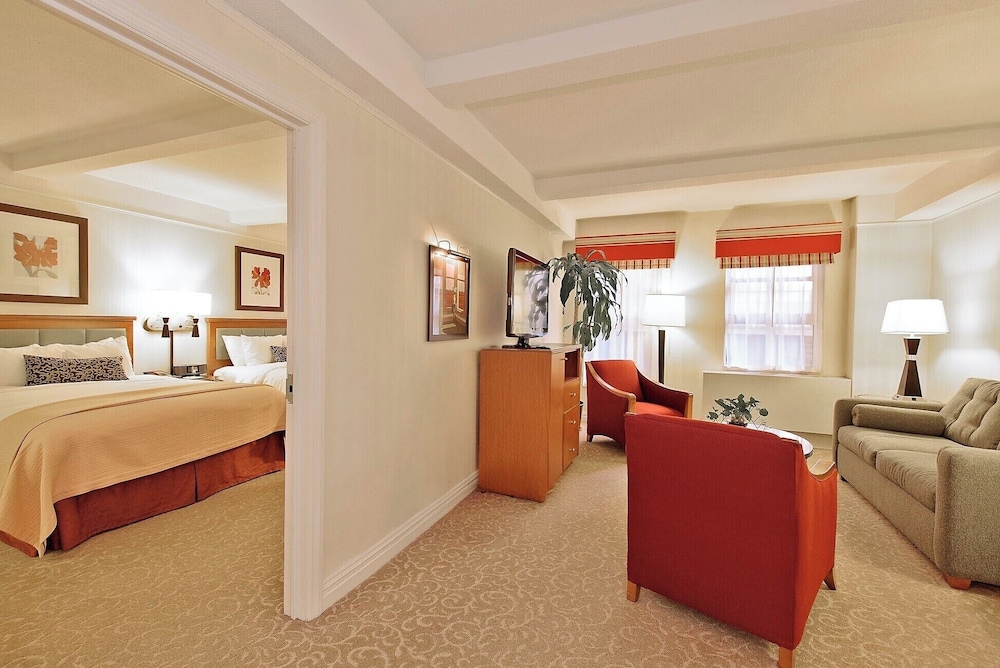 Elite Suite, 2 Queen Beds, One-bedroom Apartment with Separate adjoining Living Space and Sofa Bed