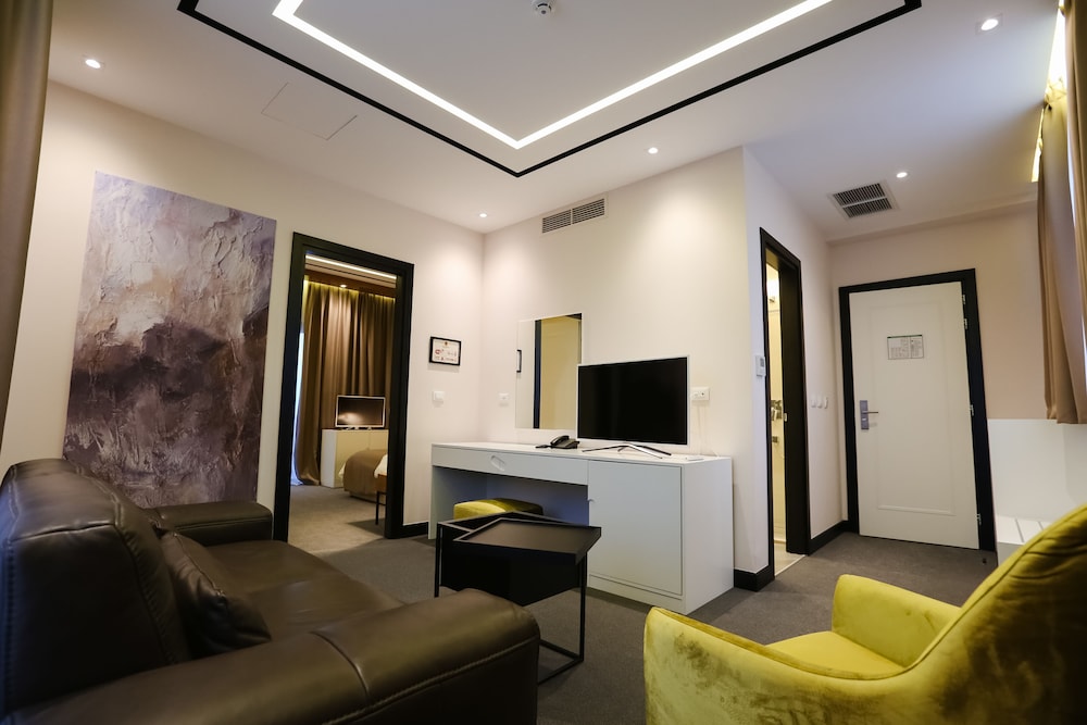 Family Comfort Suite with Double Bed, Single Bed, and Living Area