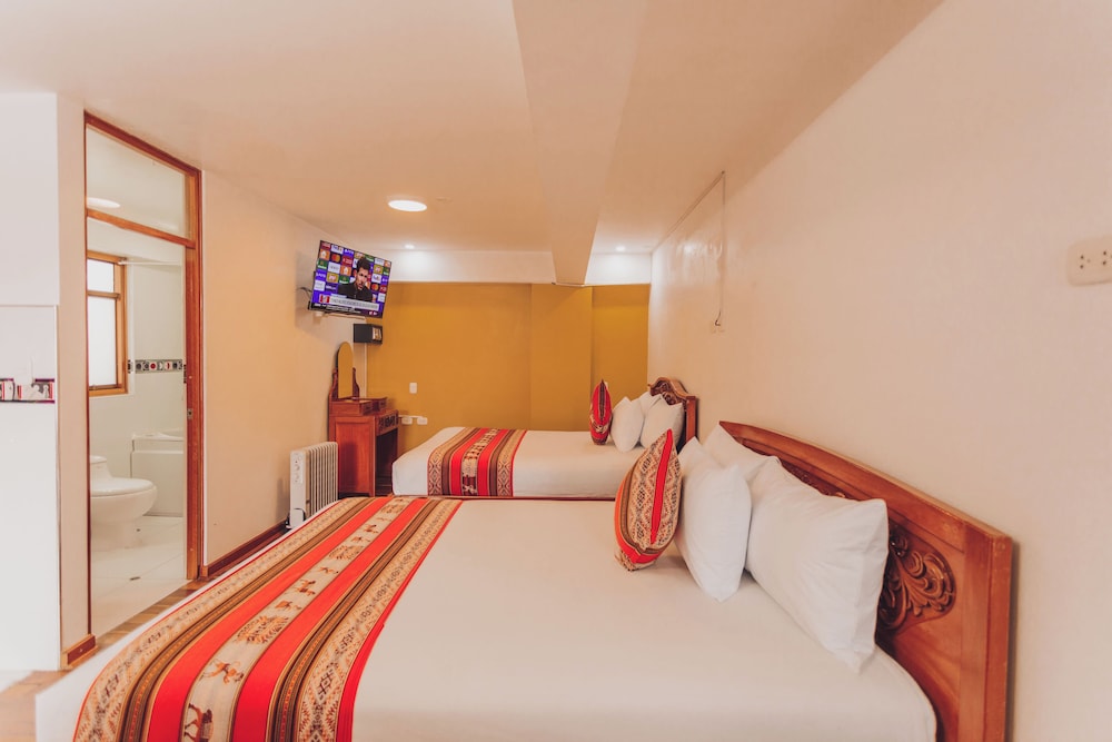 Deluxe Quadruple Room, 2 Queen Beds photo 1