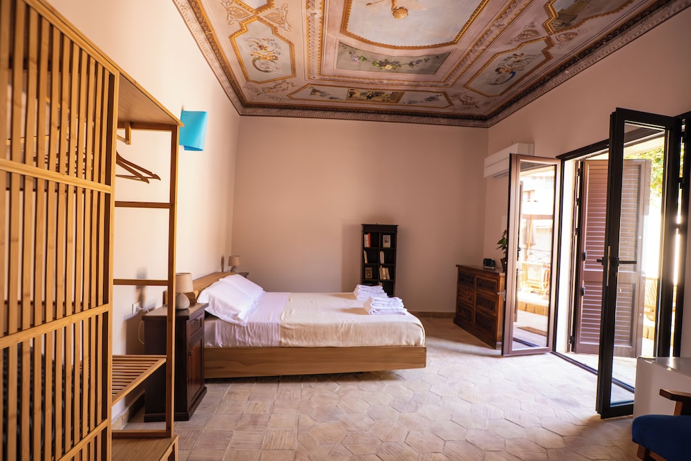 Camera Quadrupla Luxury vista giardino con bagno privato