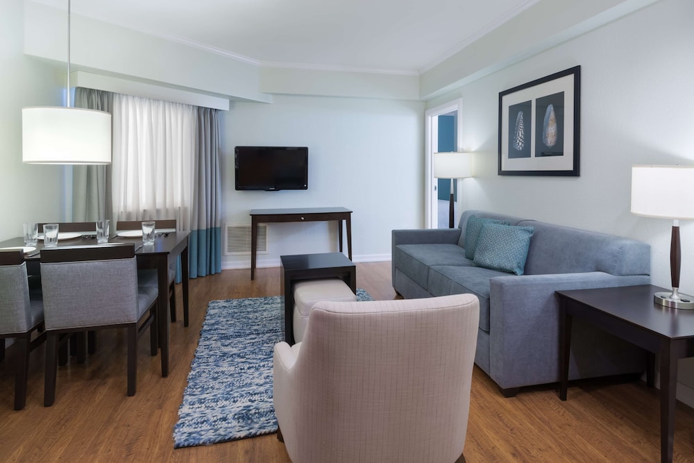 Two Bedroom Suite 1 Queen Bed, 2 Double Beds, & 1 Sofabed
