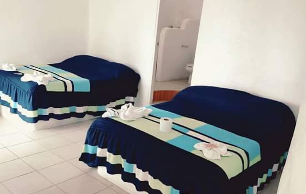 Basic Quadruple Room, 1 Bedroom, Beachside photo 2