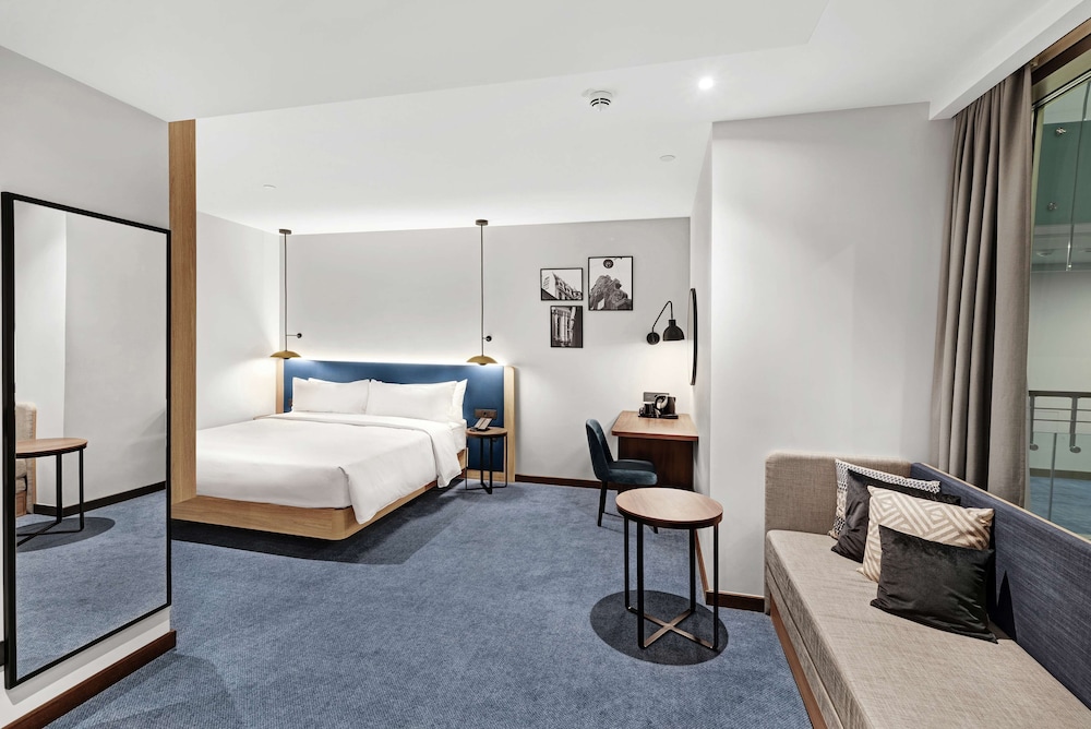 Family Room, 1 King Bed with Sofa bed (Atrium View) - Photo 1