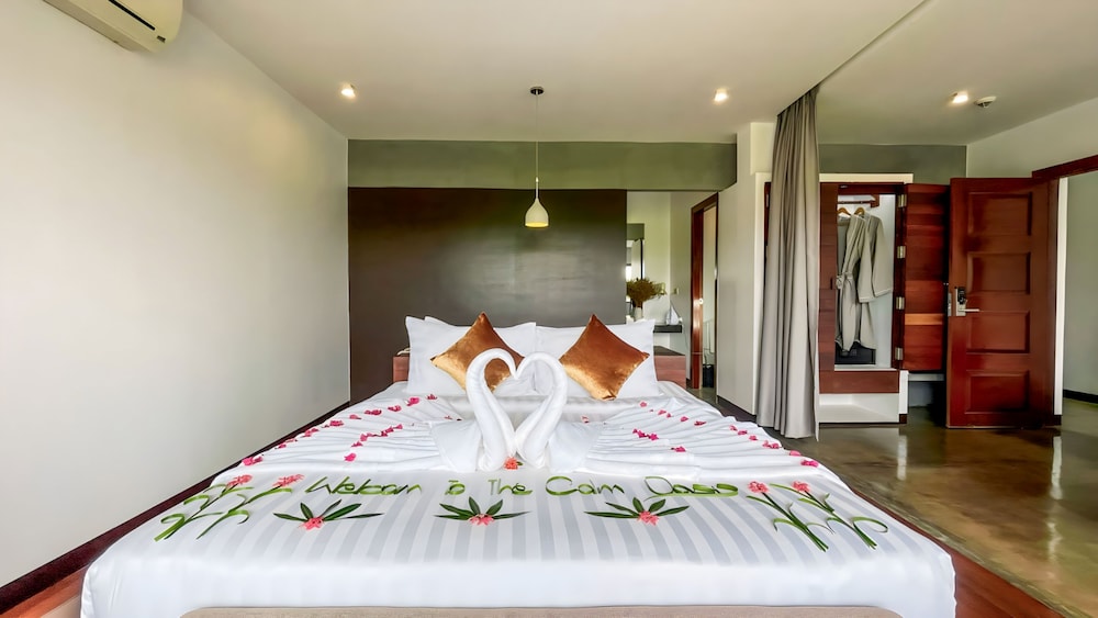 Junior King Suite City View with Balcony, Sofa Area, and Bathtub