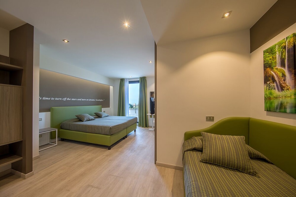 Superior Triple Room, Balcony, Partial Lake View - Photo 1