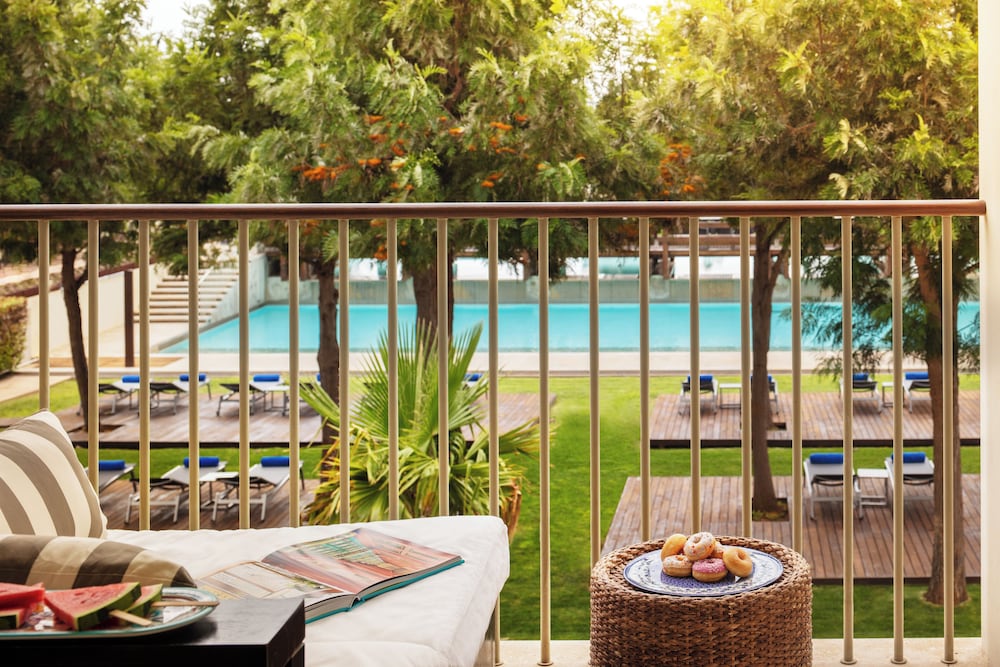 Deluxe Room, 1 King Bed, Balcony, Pool View - Photo 2