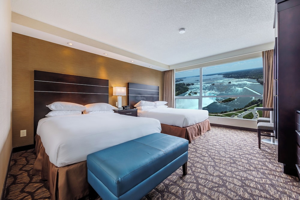 2 Queen Beds with Sofa Bed and partial view of Niagara Falls - Floors 10-25