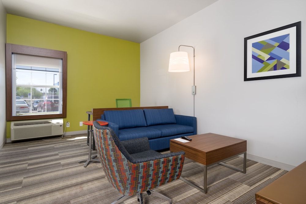 living room with a blue couch and a coffee table